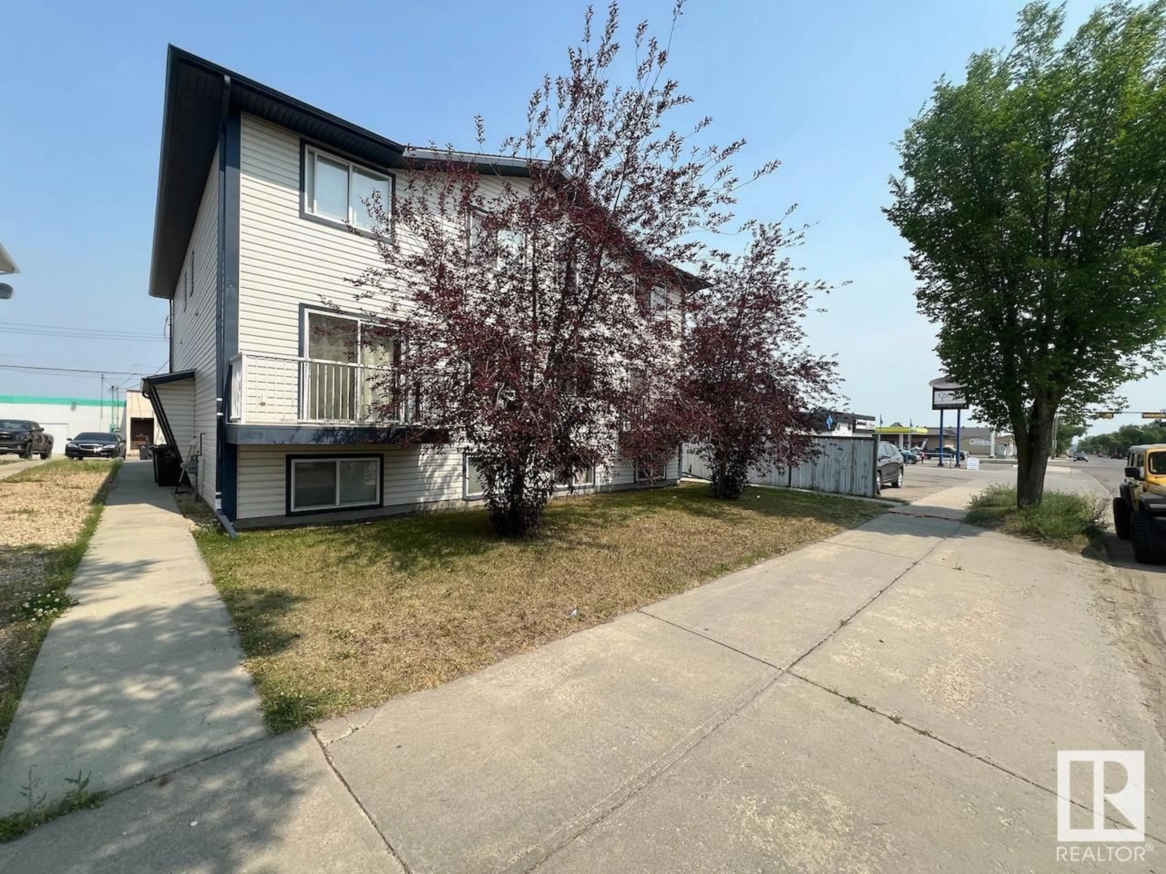 A pic from exterior of the house or condo, the fenced backyard for #1 5020 50 AV, Drayton Valley Alberta T7A1S4