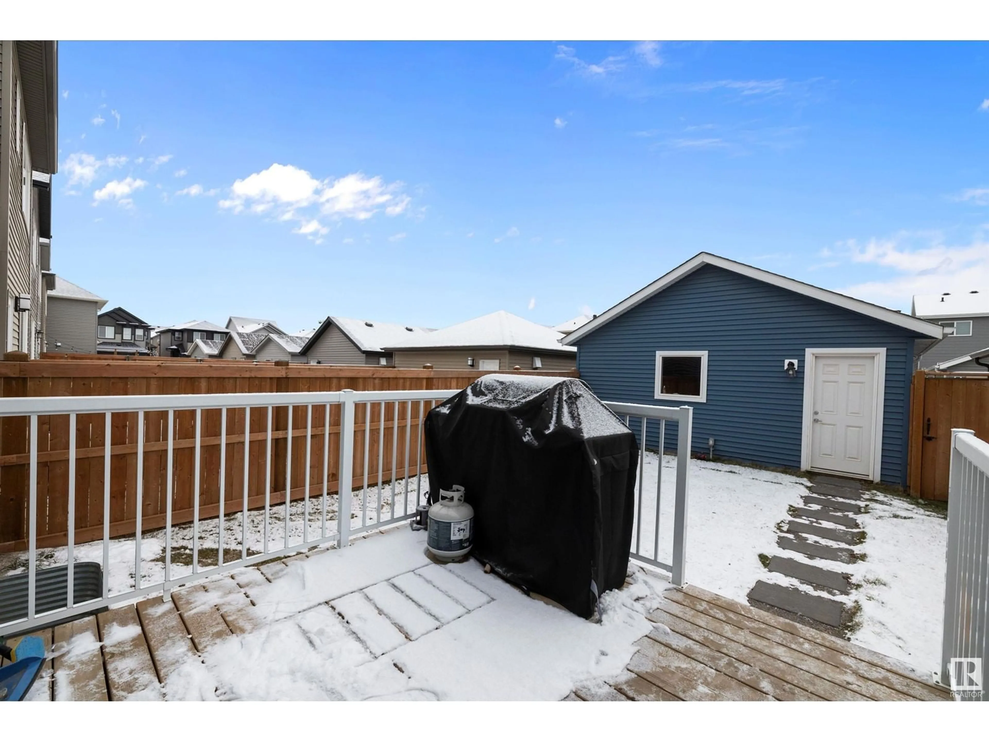 Frontside or backside of a home, the fenced backyard for 22347 93 AV NW, Edmonton Alberta T5T7L9