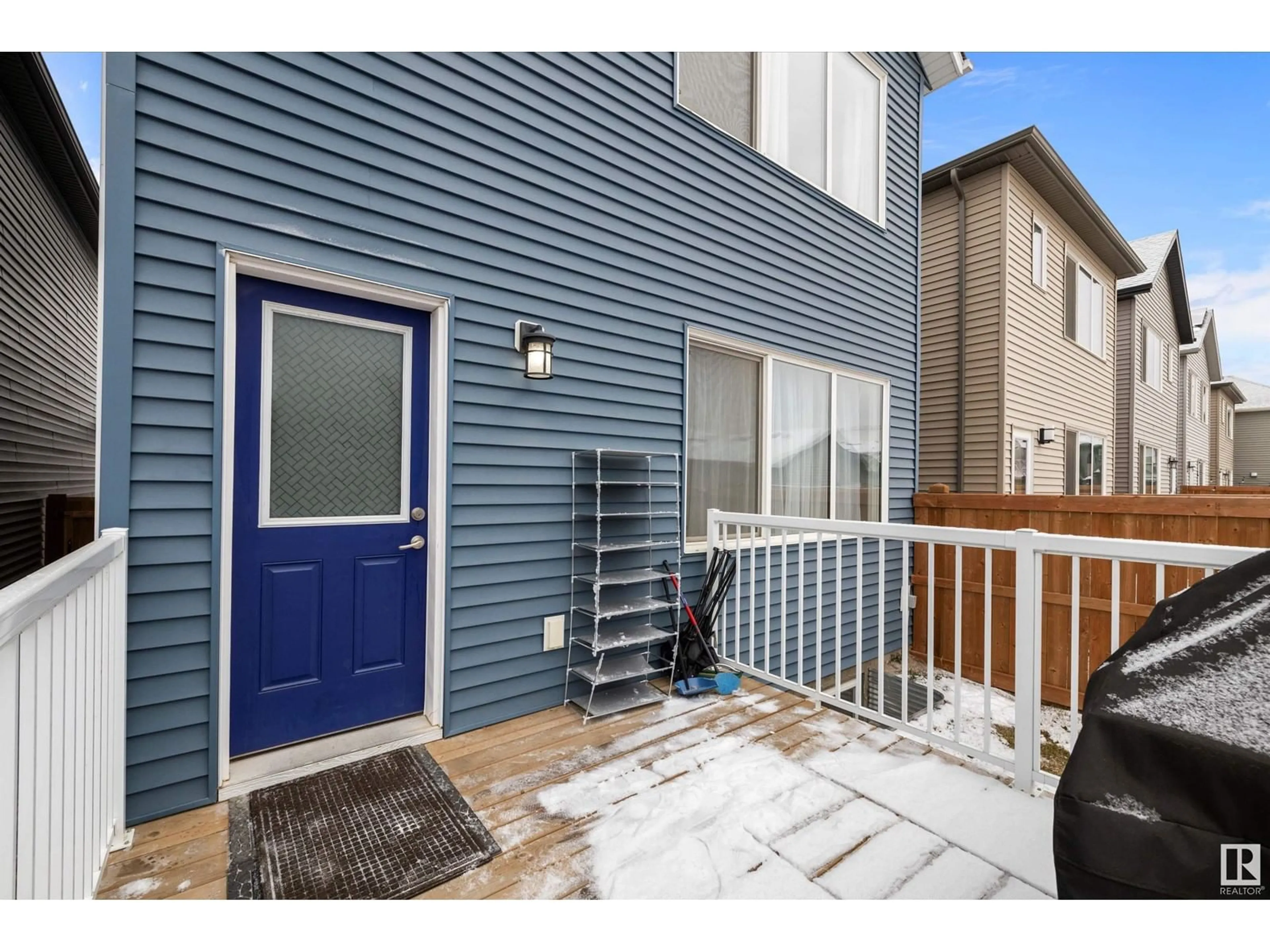 A pic from exterior of the house or condo, the fenced backyard for 22347 93 AV NW, Edmonton Alberta T5T7L9