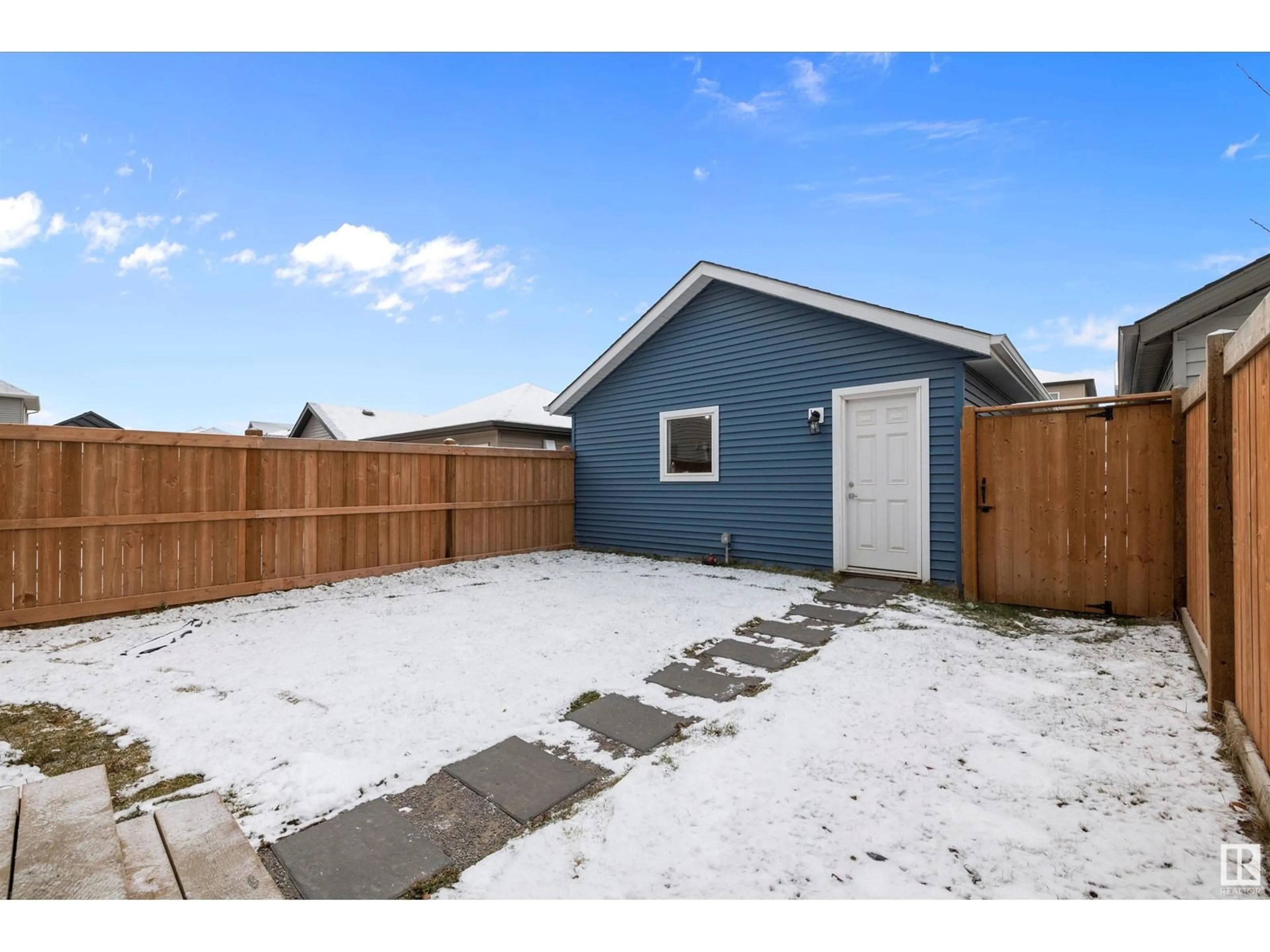 Frontside or backside of a home, the fenced backyard for 22347 93 AV NW, Edmonton Alberta T5T7L9