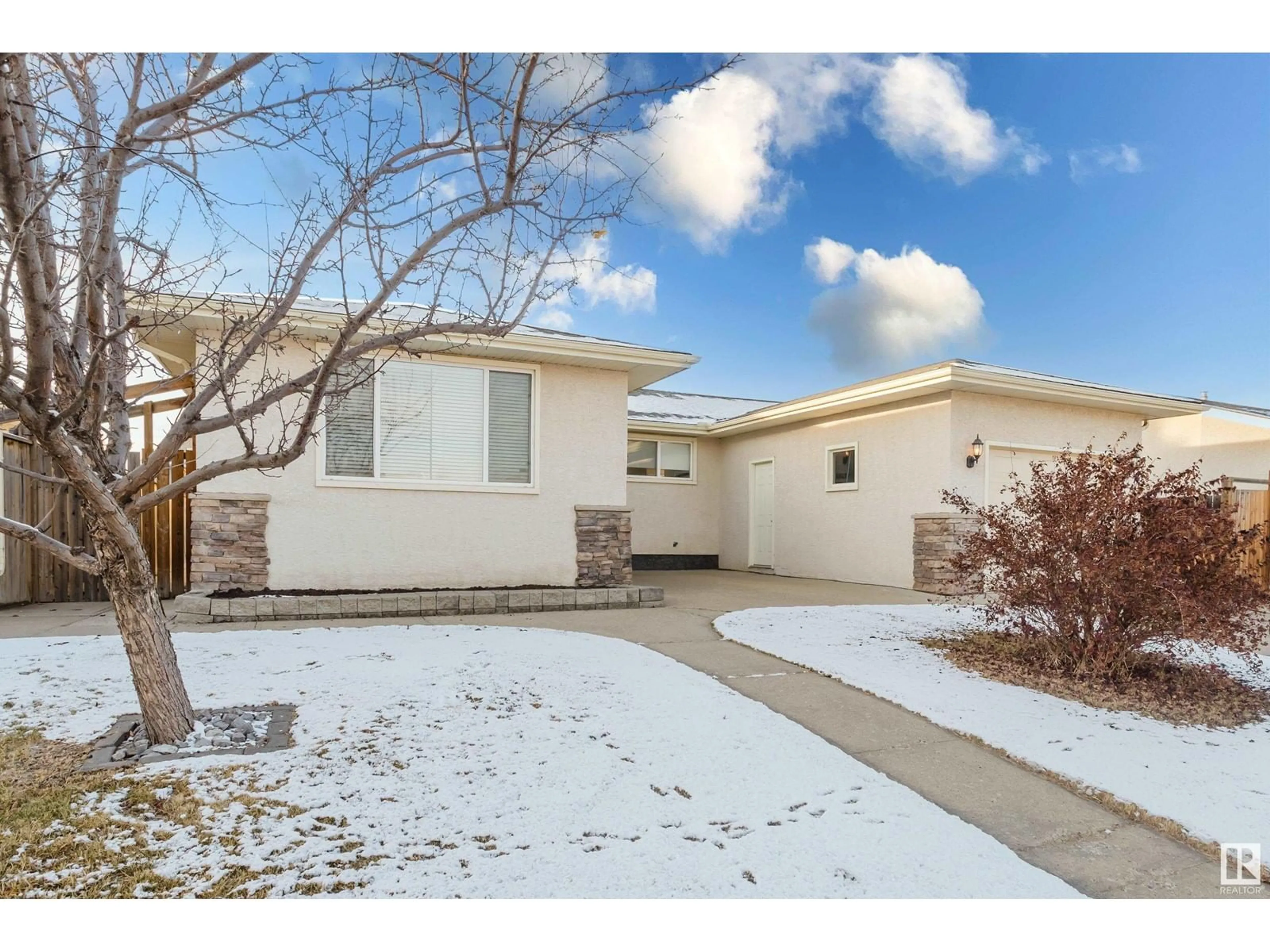 A pic from exterior of the house or condo, the fenced backyard for 12812 47 ST NW, Edmonton Alberta T5A2J9