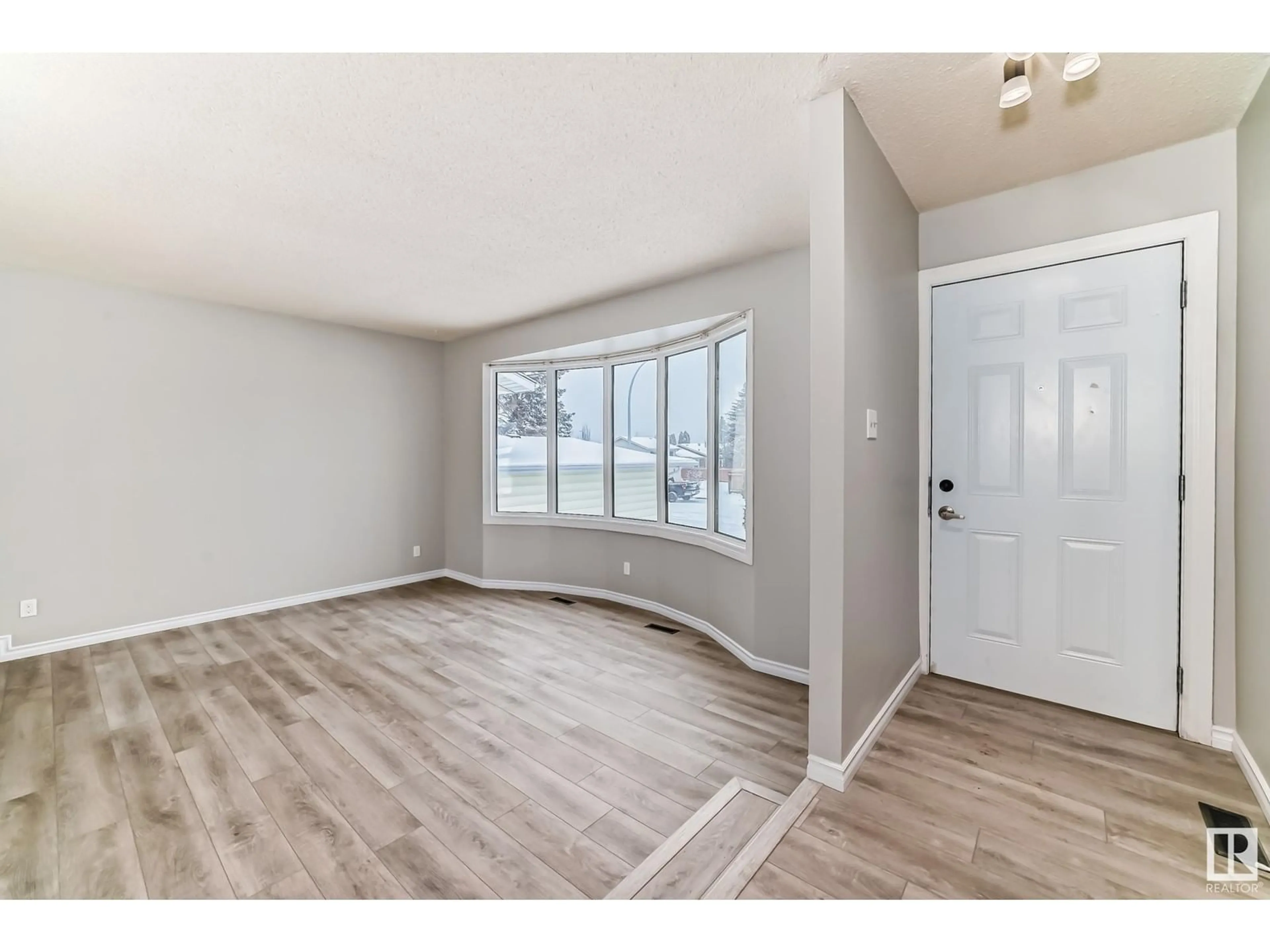 A pic of a room, wood floors for 4811 17 AV NW, Edmonton Alberta T6L2Y8