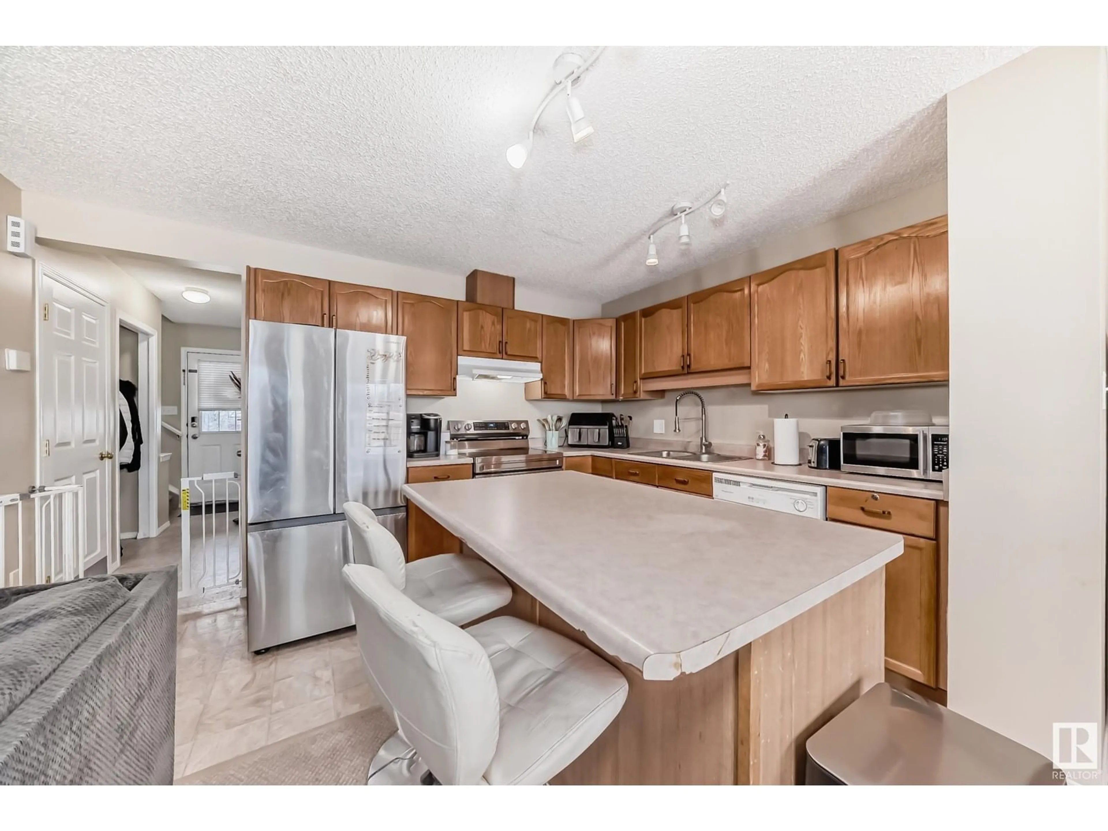 Open concept kitchen for 2815 30 ST NW NW, Edmonton Alberta T6T1V2