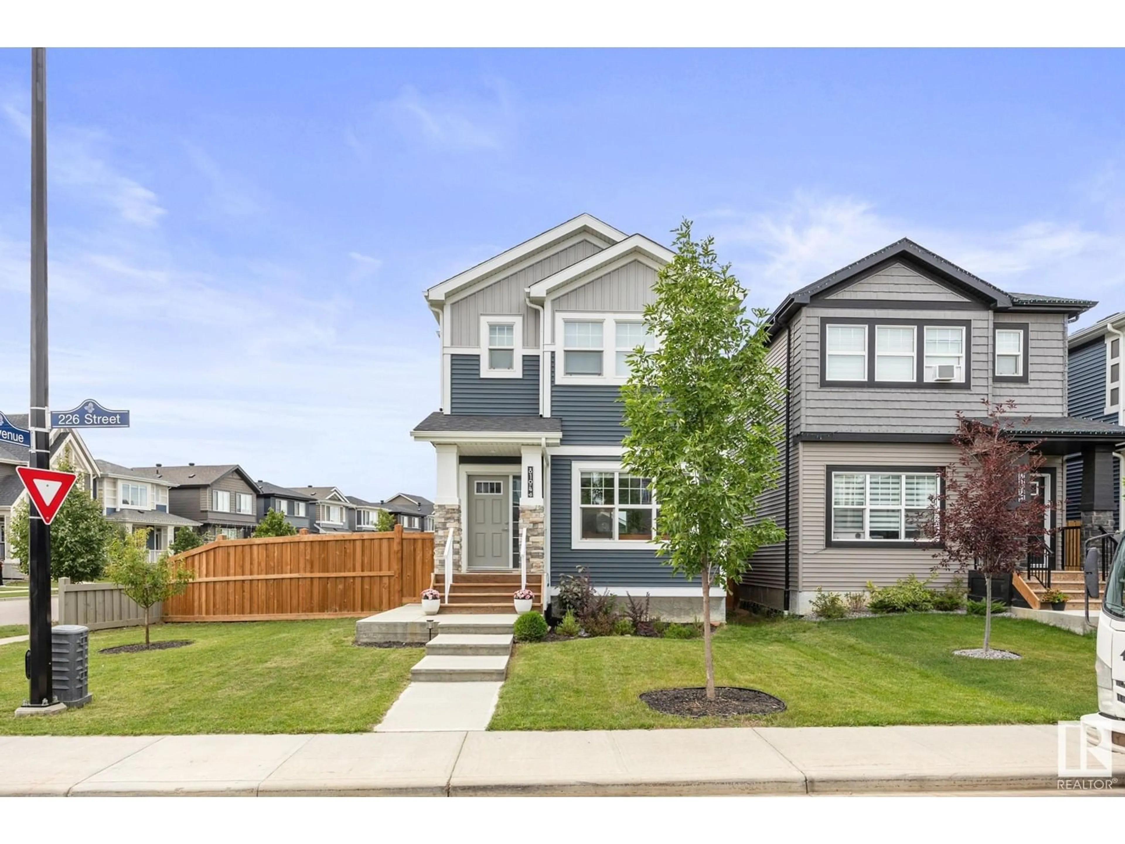 Frontside or backside of a home, the fenced backyard for 8104 226 ST NW, Edmonton Alberta T5T7K9