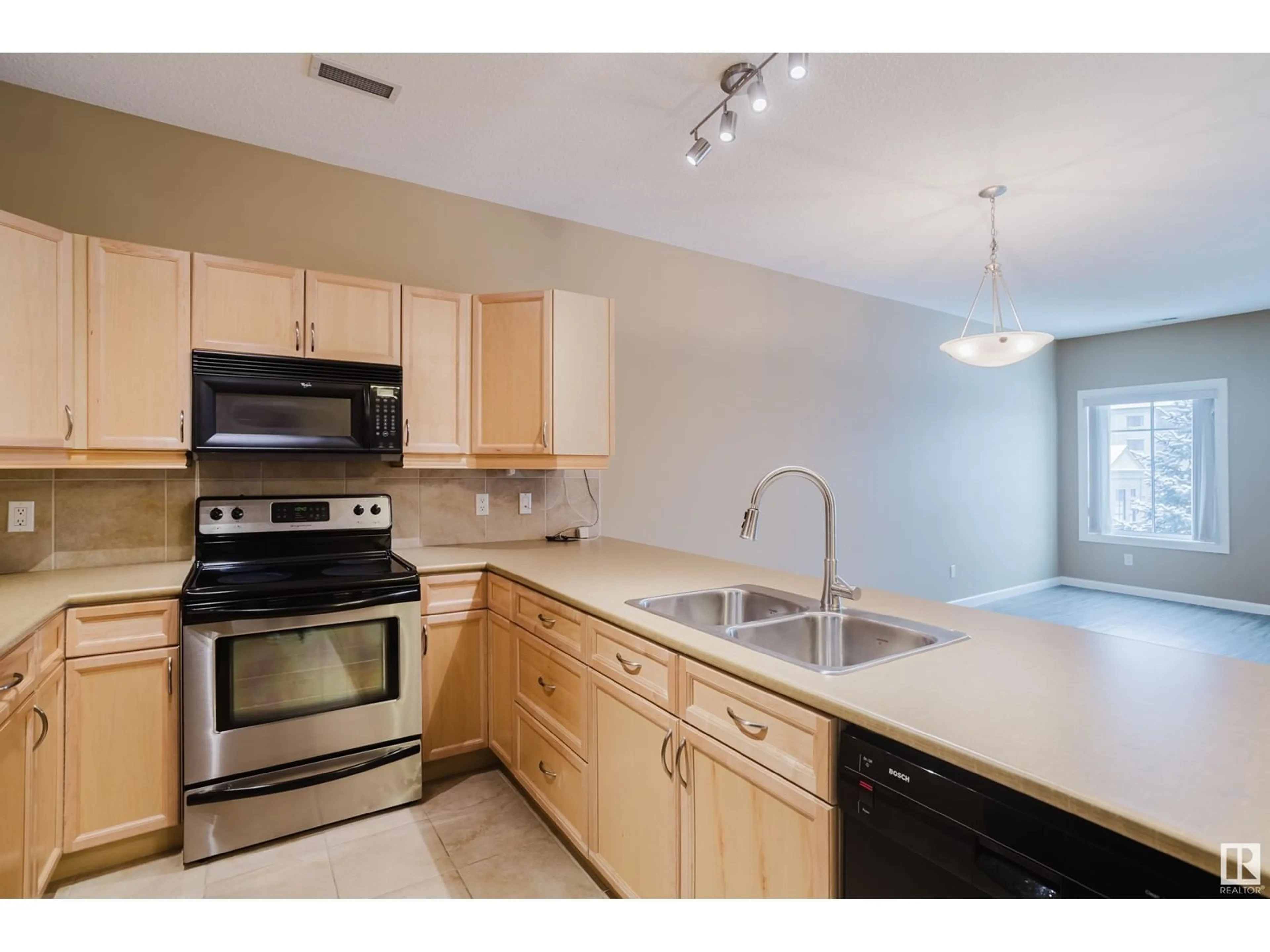 Standard kitchen, wood floors for #239 160 Magrath RD NW, Edmonton Alberta T6R3T7