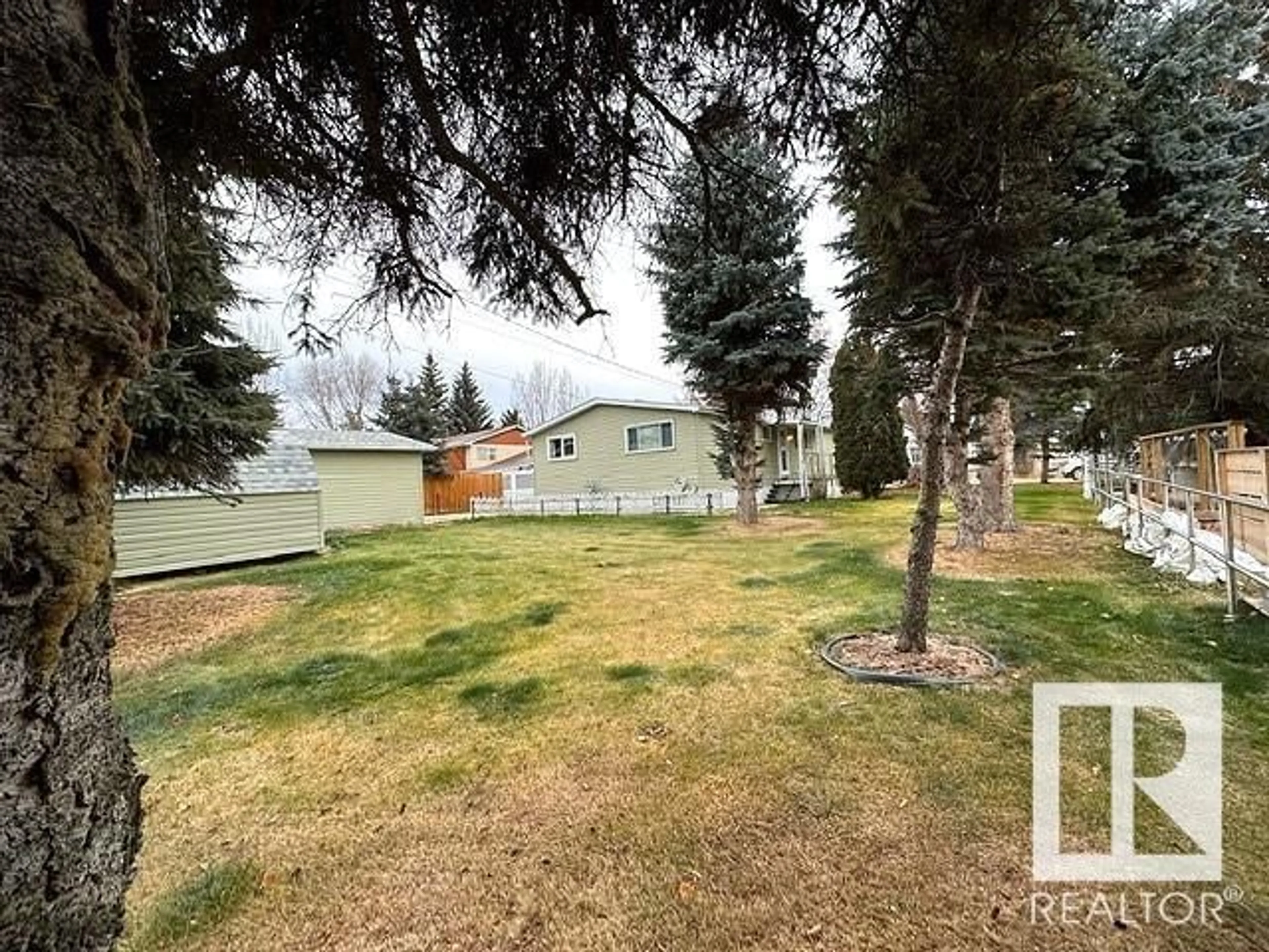 A pic from exterior of the house or condo, the fenced backyard for 5216 49 ST, Waskatenau Alberta T0A3P0