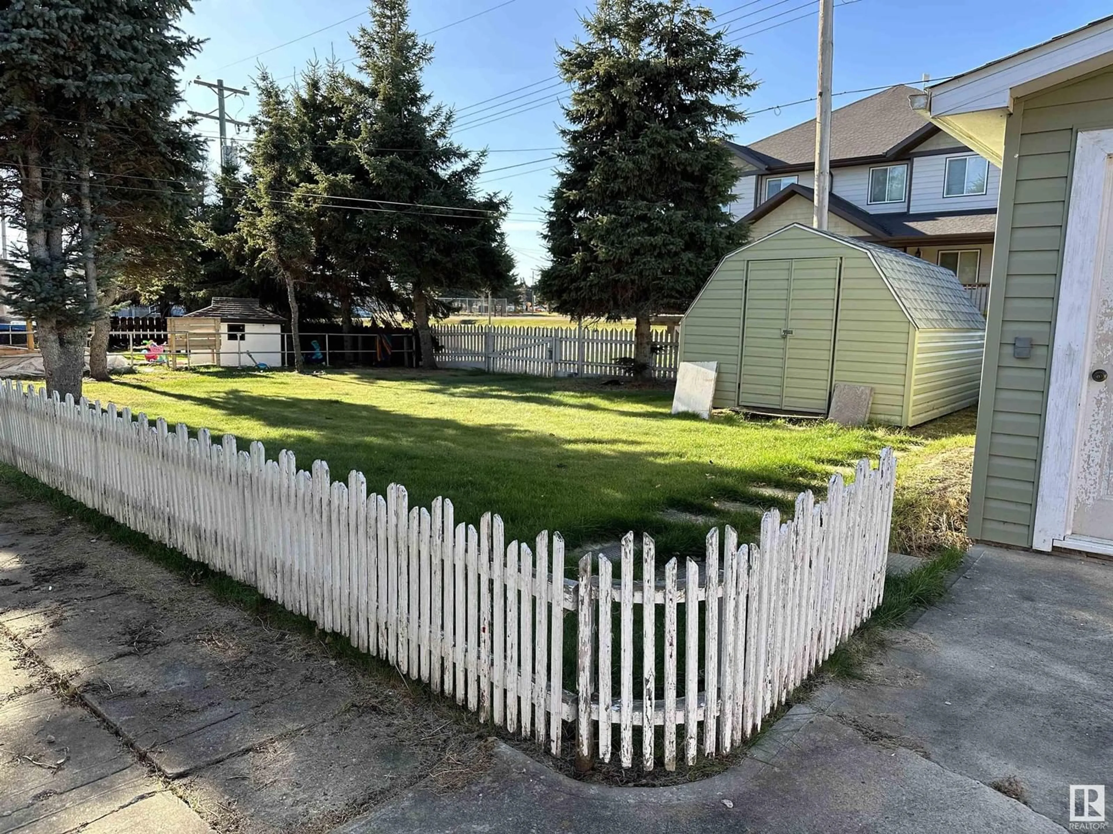 Frontside or backside of a home, the fenced backyard for 5216 49 ST, Waskatenau Alberta T0A3P0