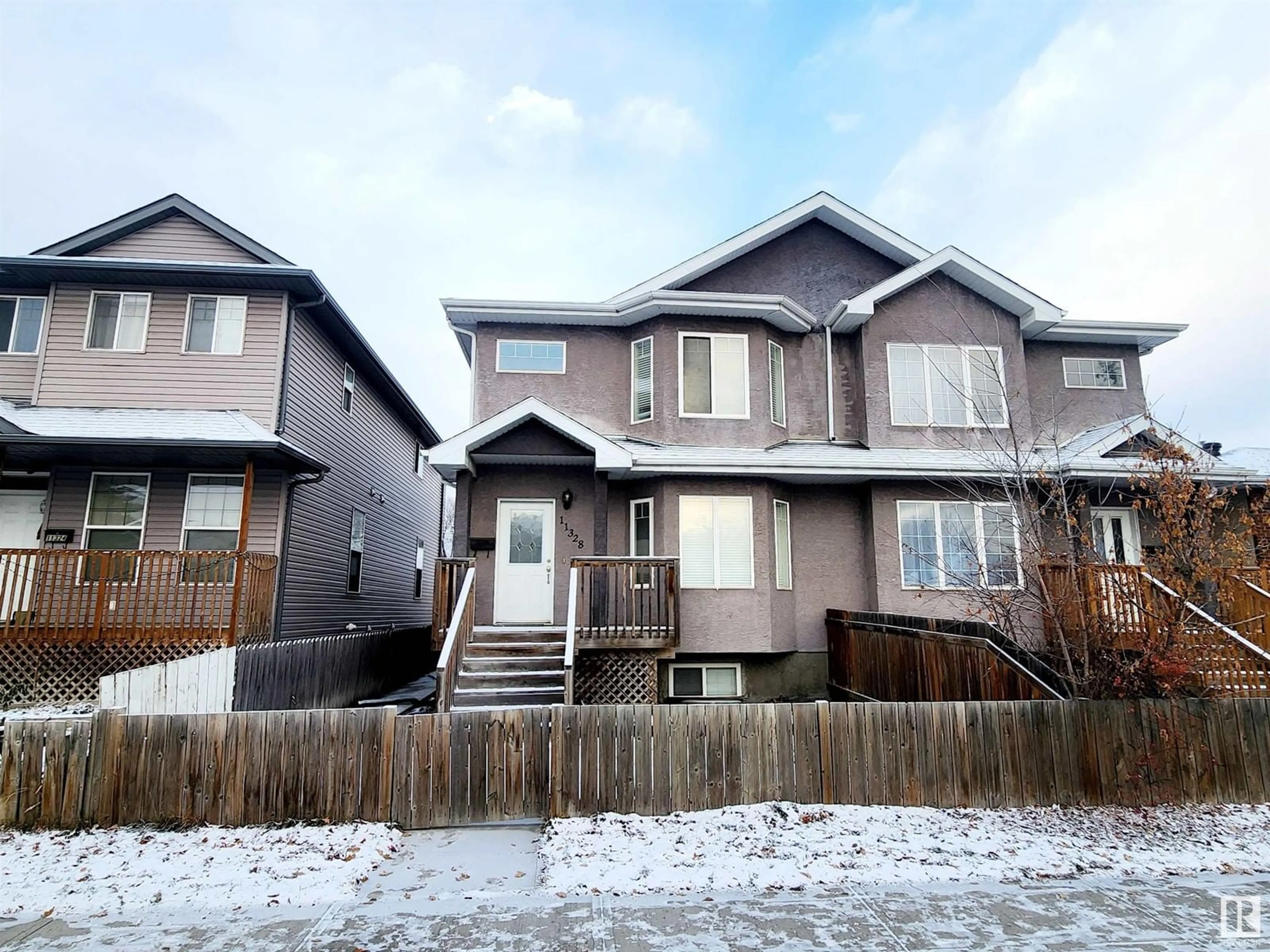 Frontside or backside of a home, the fenced backyard for 11328 86 ST NW, Edmonton Alberta T5B3J1