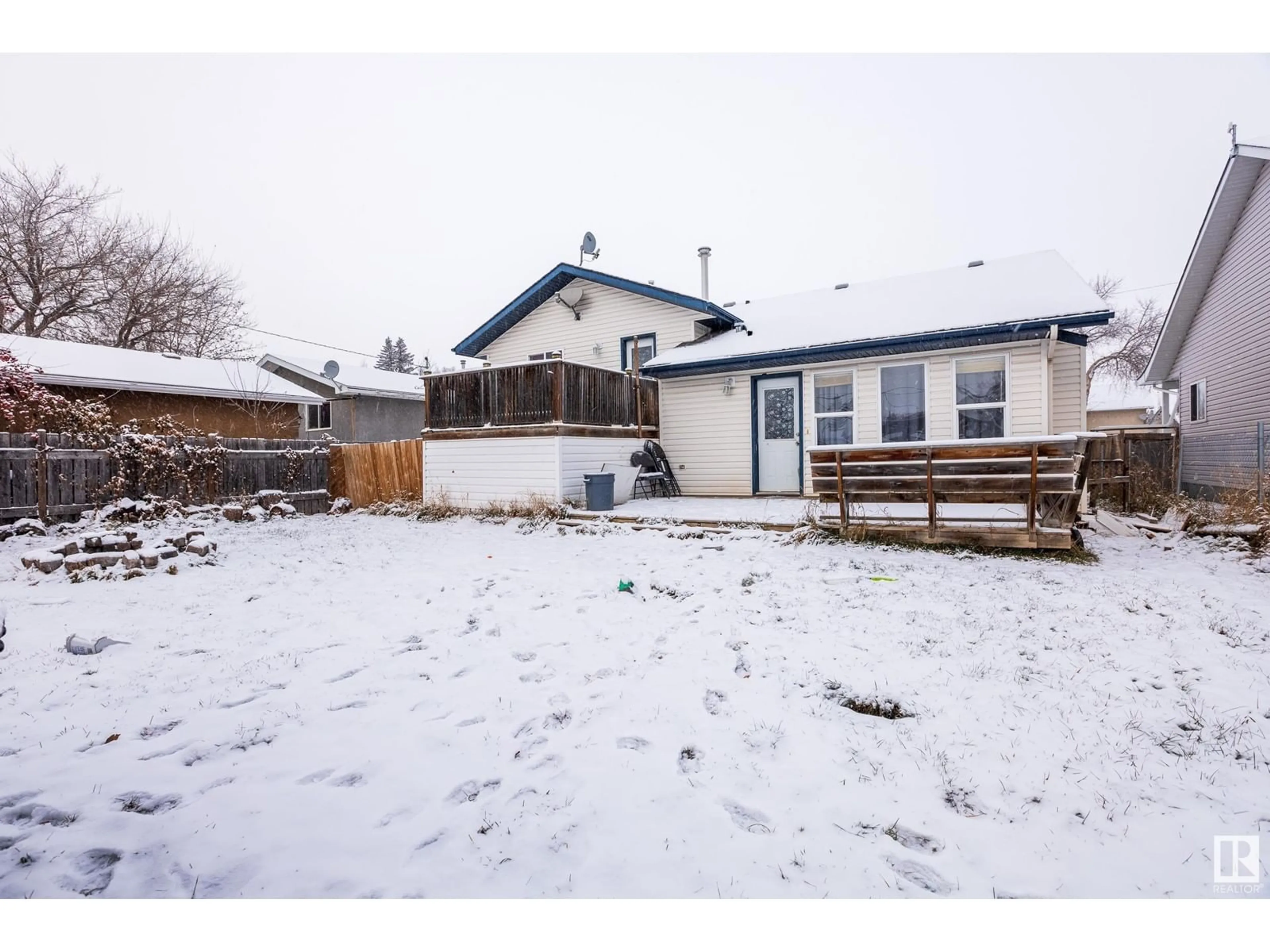 Frontside or backside of a home, the fenced backyard for 4713 49 AV, Legal Alberta T0G1L0