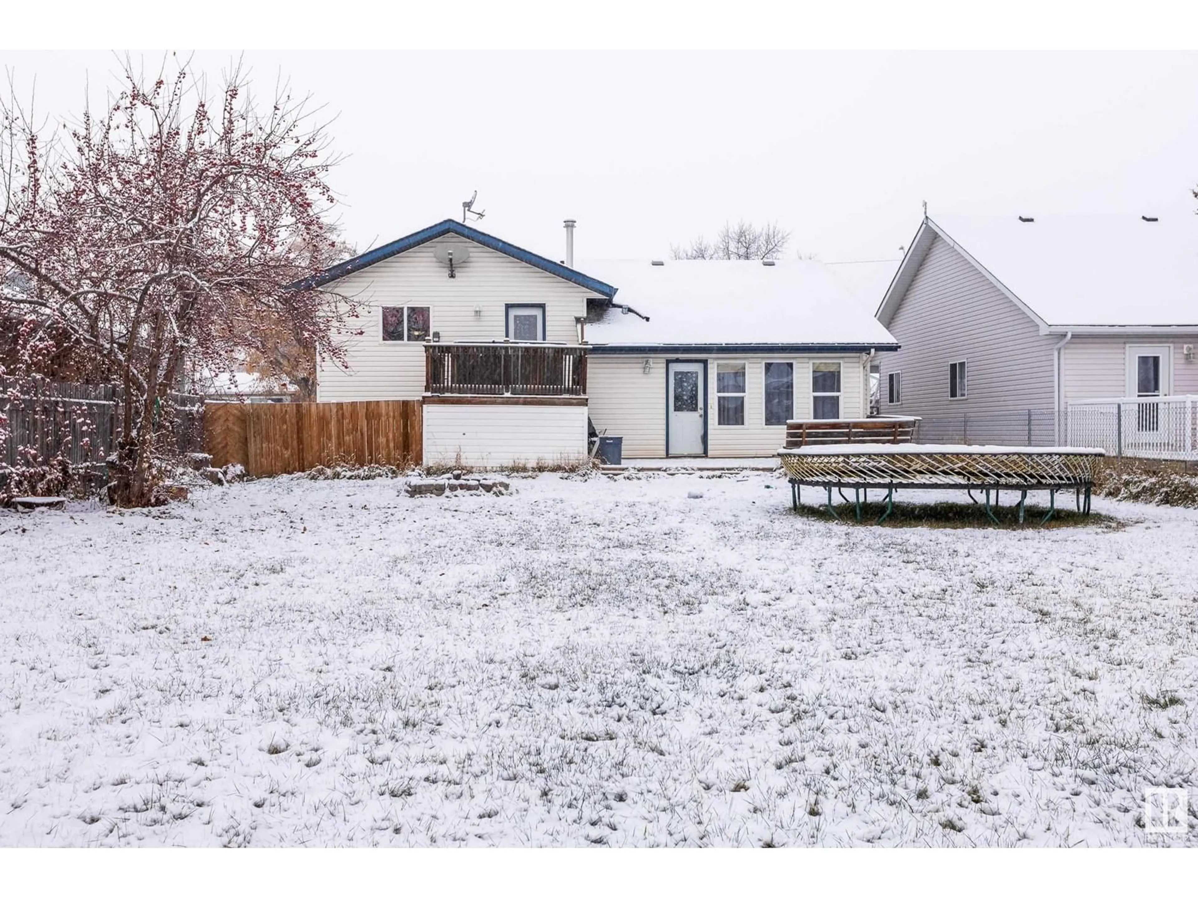 Frontside or backside of a home, the fenced backyard for 4713 49 AV, Legal Alberta T0G1L0