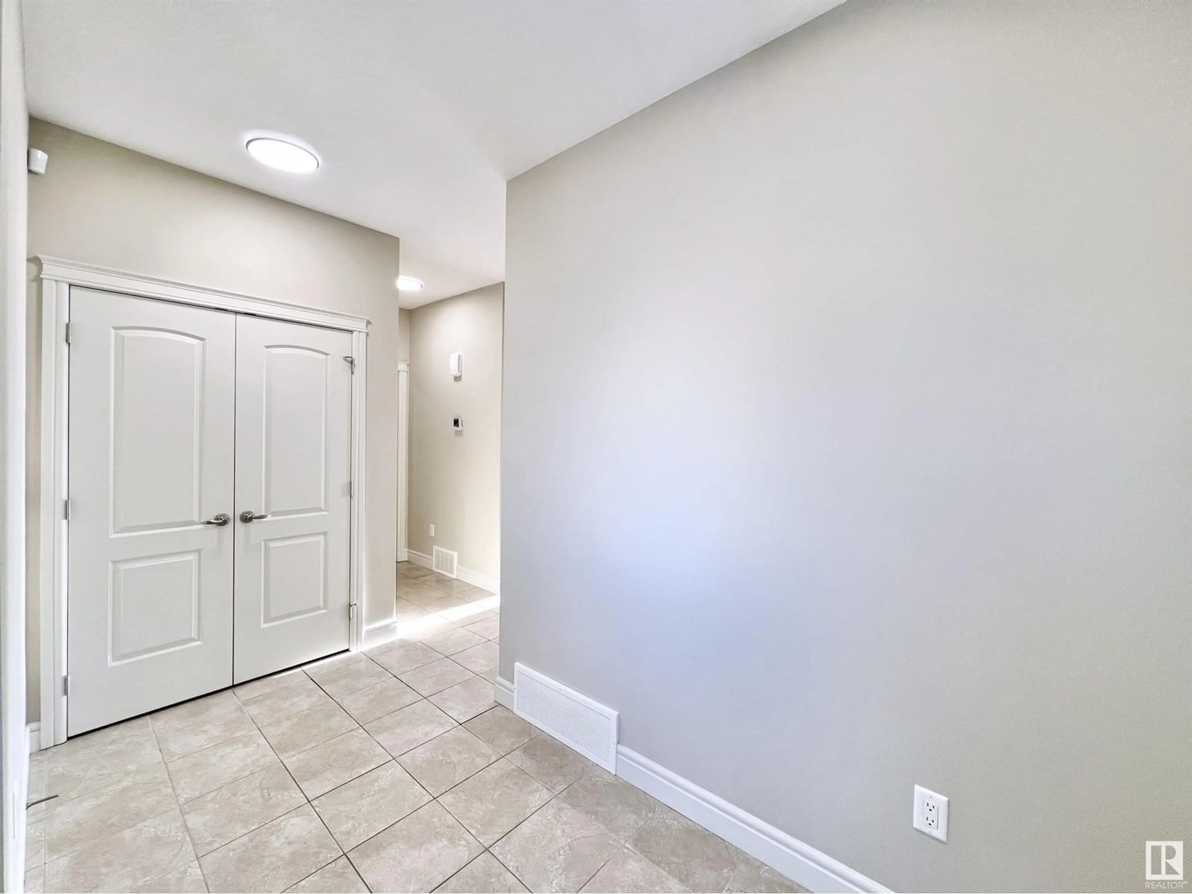 Indoor entryway, cement floor for 16607 18 AV SW, Edmonton Alberta T6W3C5