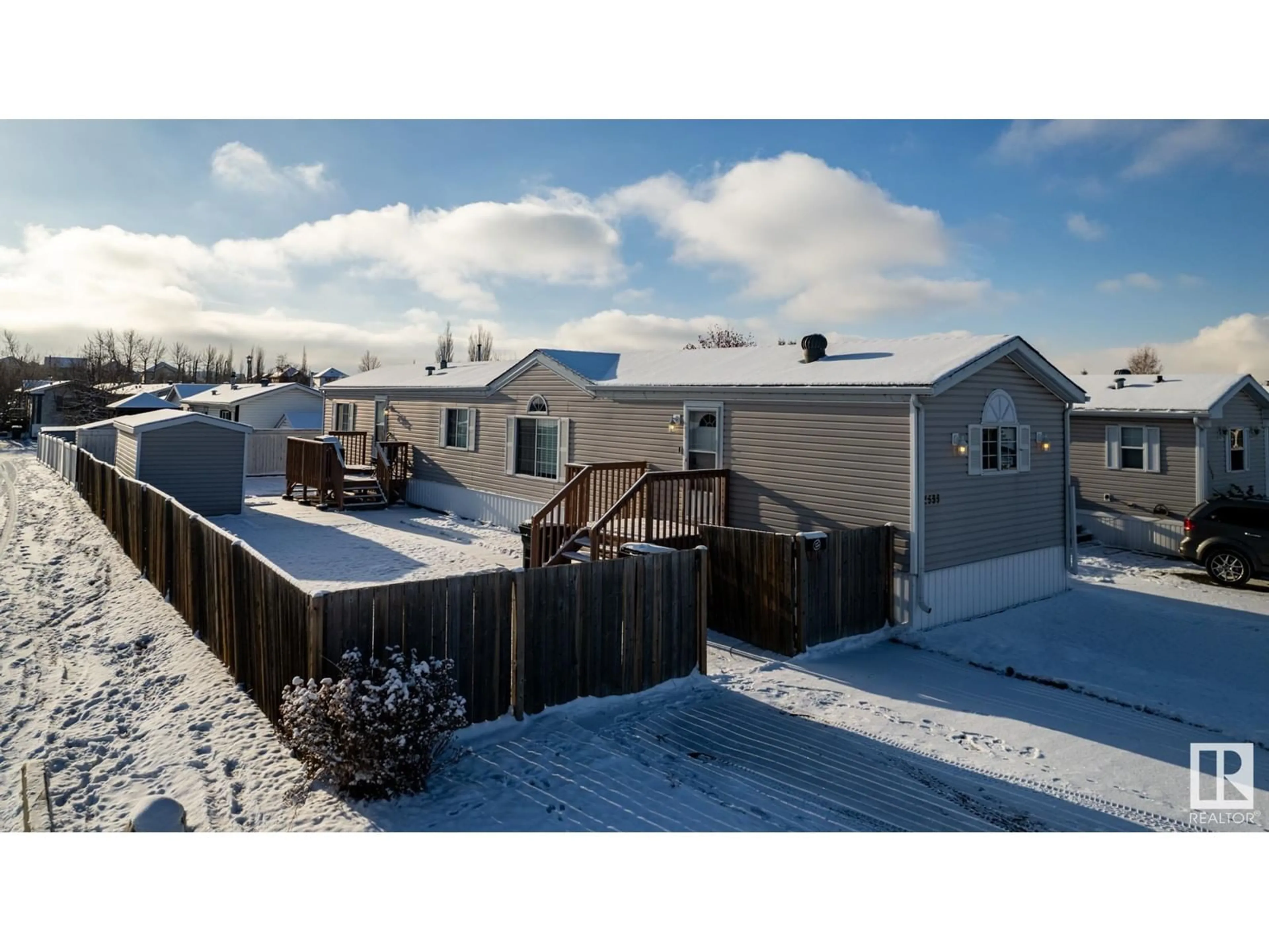 A pic from exterior of the house or condo, the fenced backyard for 1533 Jubilee DR, Sherwood Park Alberta T8H1V2