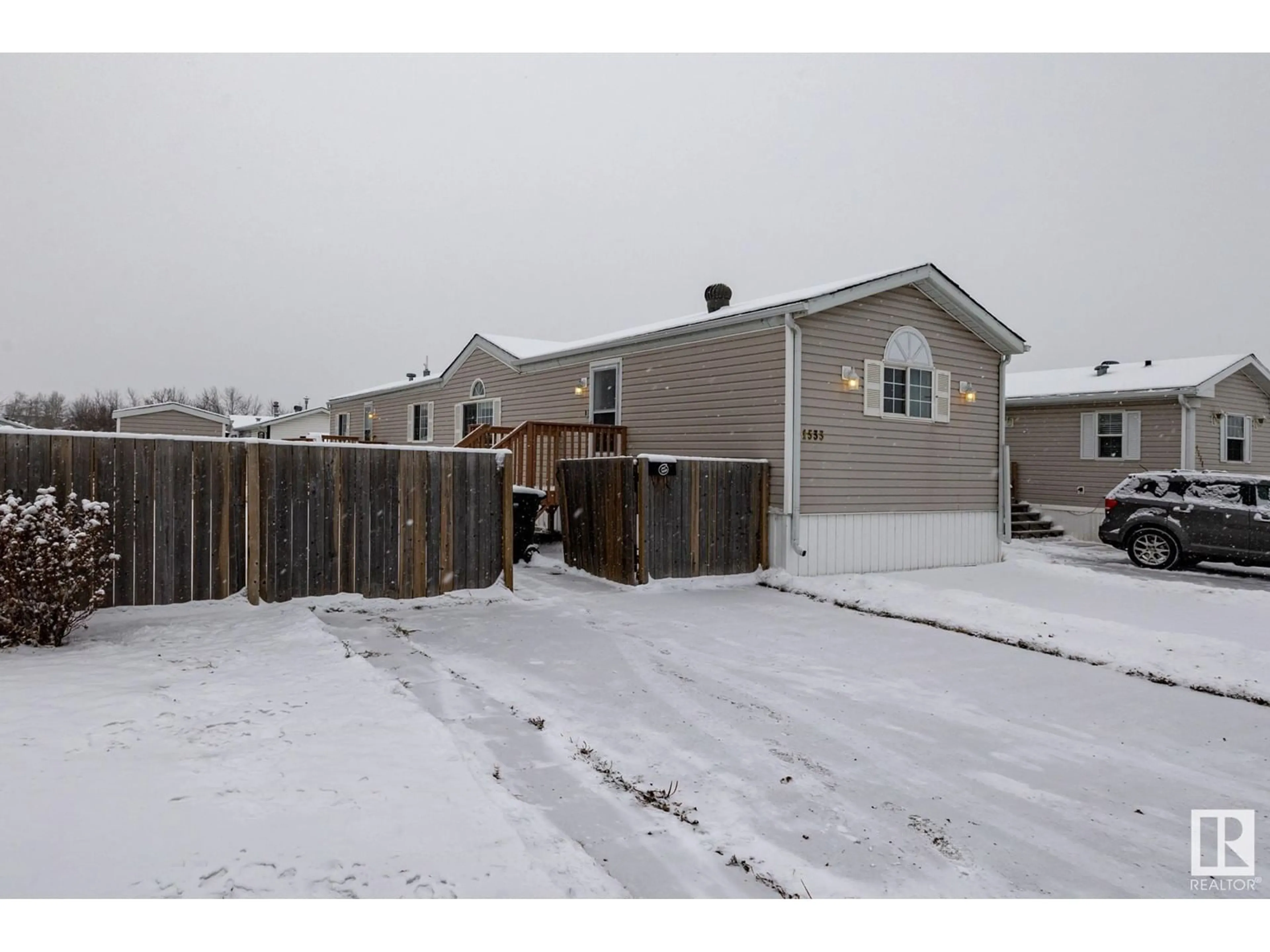 A pic from exterior of the house or condo, the fenced backyard for 1533 Jubilee DR, Sherwood Park Alberta T8H1V2