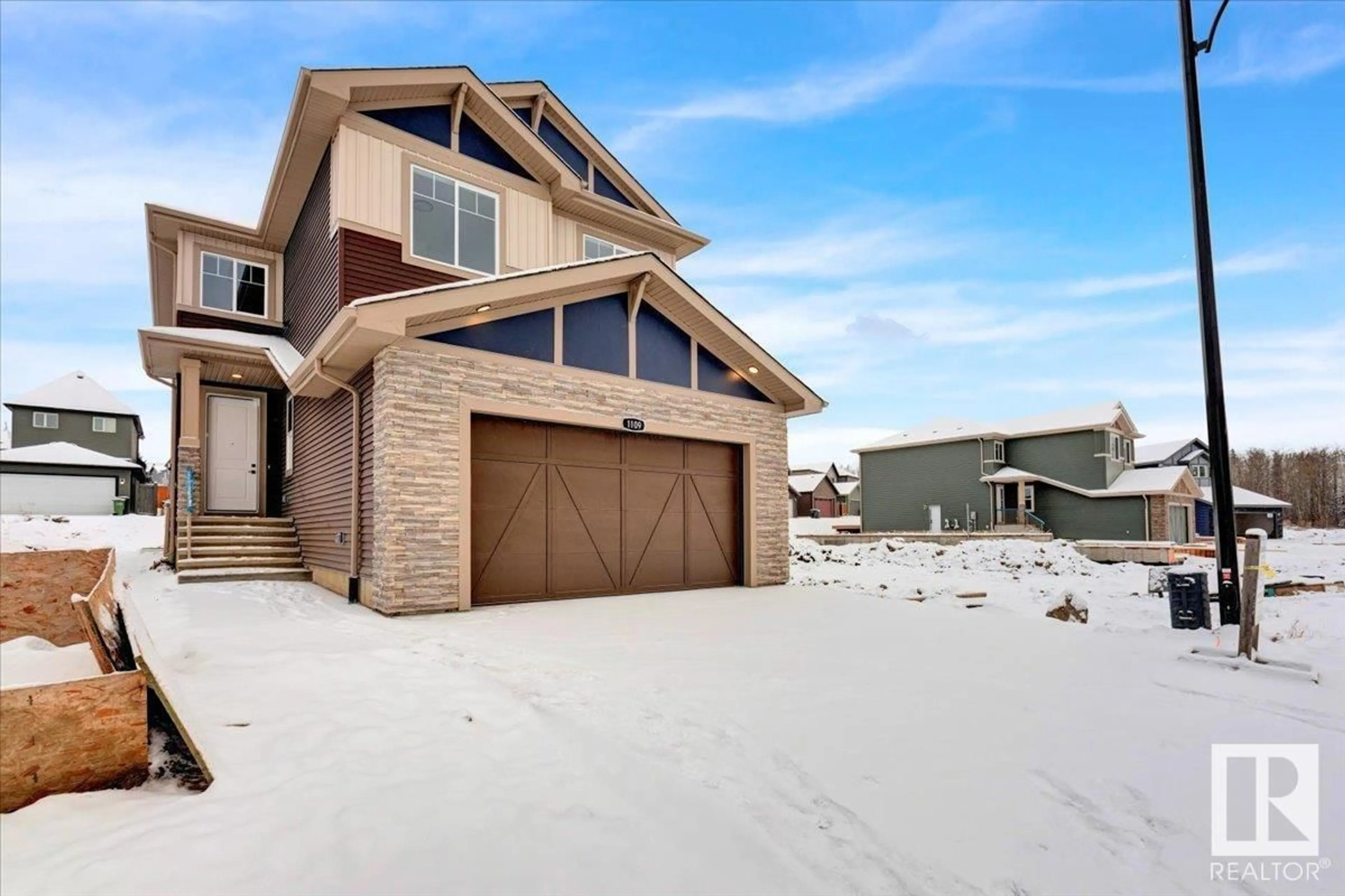 Frontside or backside of a home, the street view for 1109 GYRFALCON CR NW, Edmonton Alberta T5S0S5