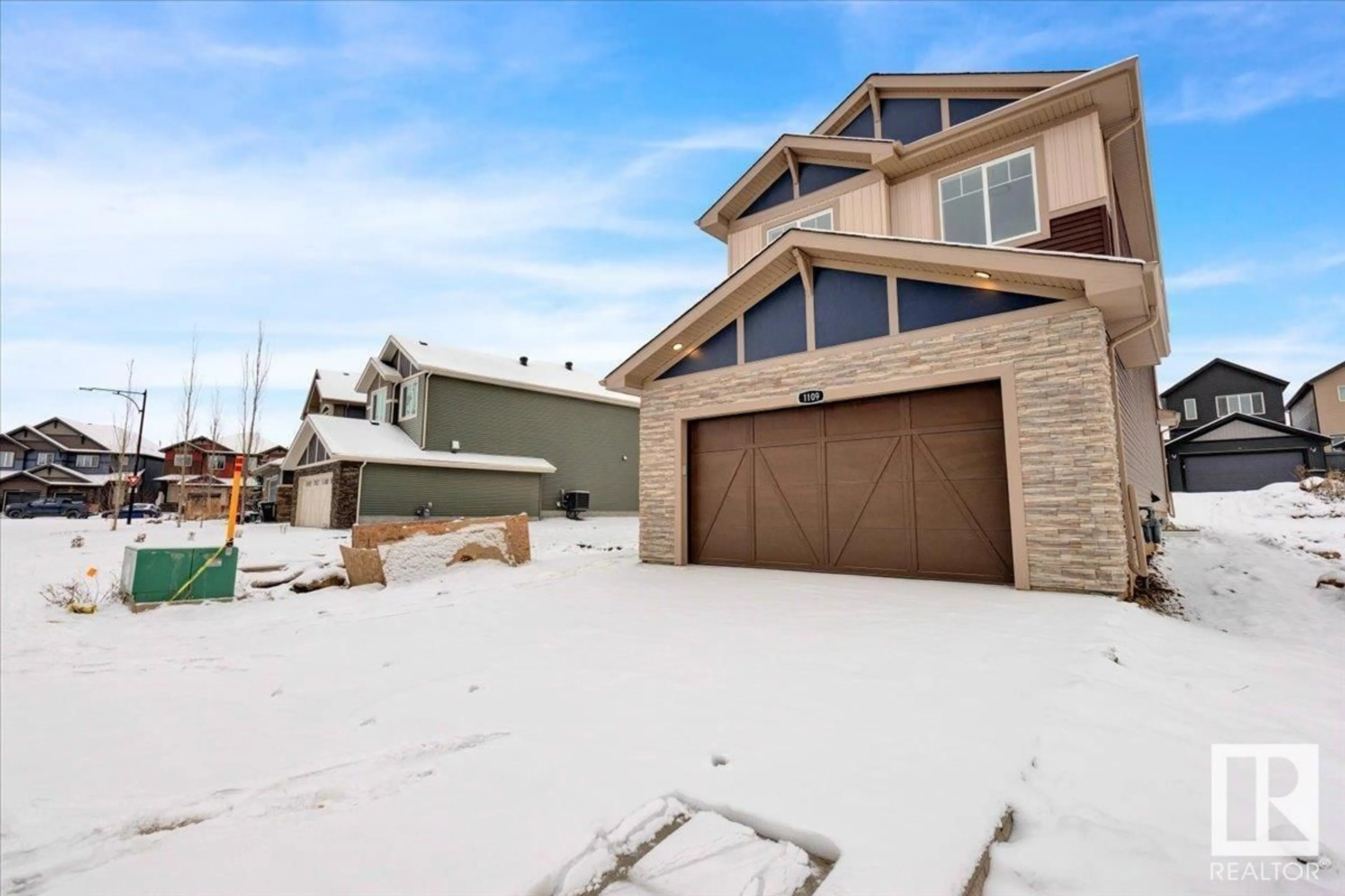 Frontside or backside of a home, the street view for 1109 GYRFALCON CR NW, Edmonton Alberta T5S0S5