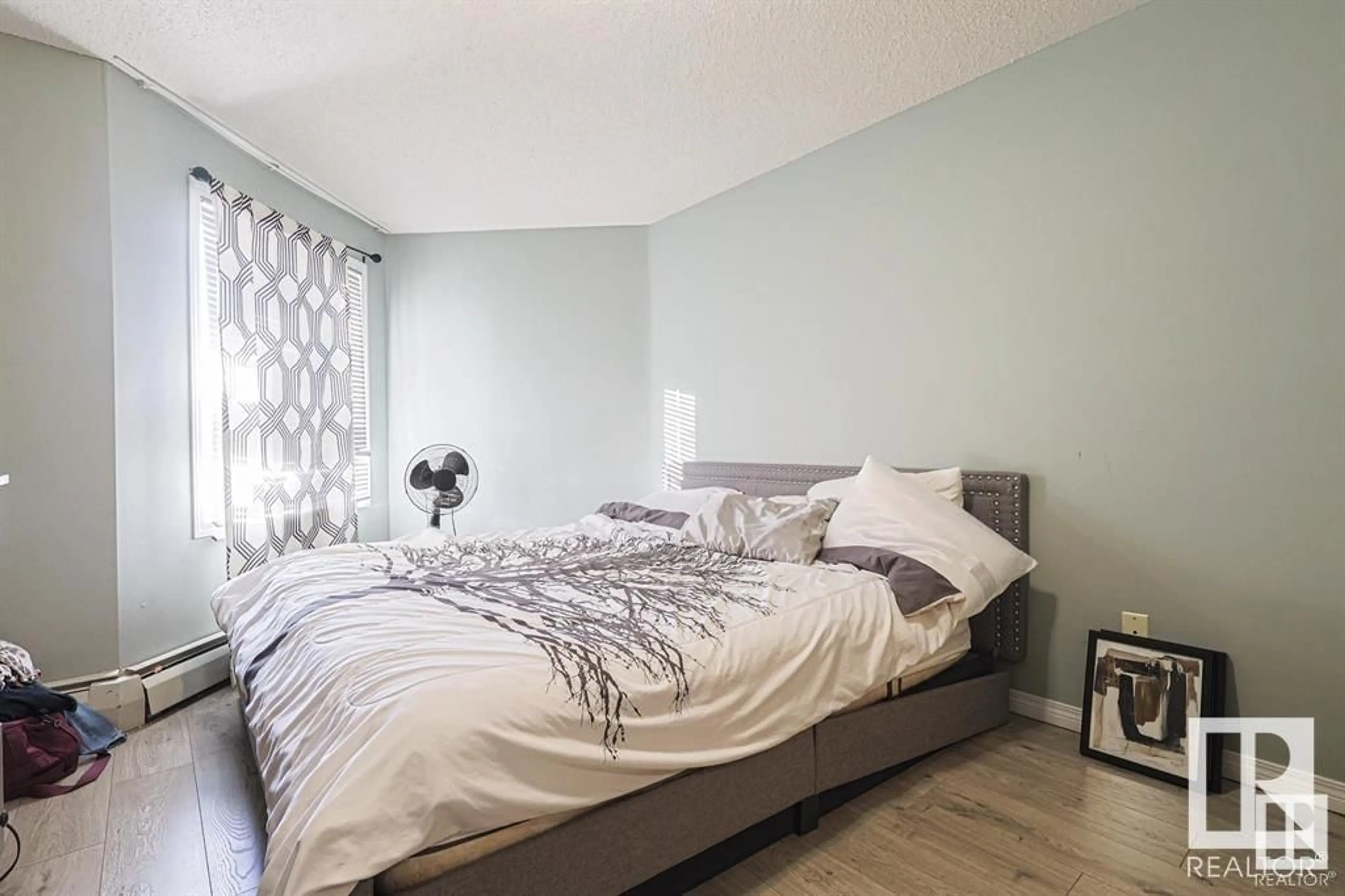 Bedroom with bed, wood/laminate floor for #328 5350 199 ST NW NW, Edmonton Alberta T6M0A4