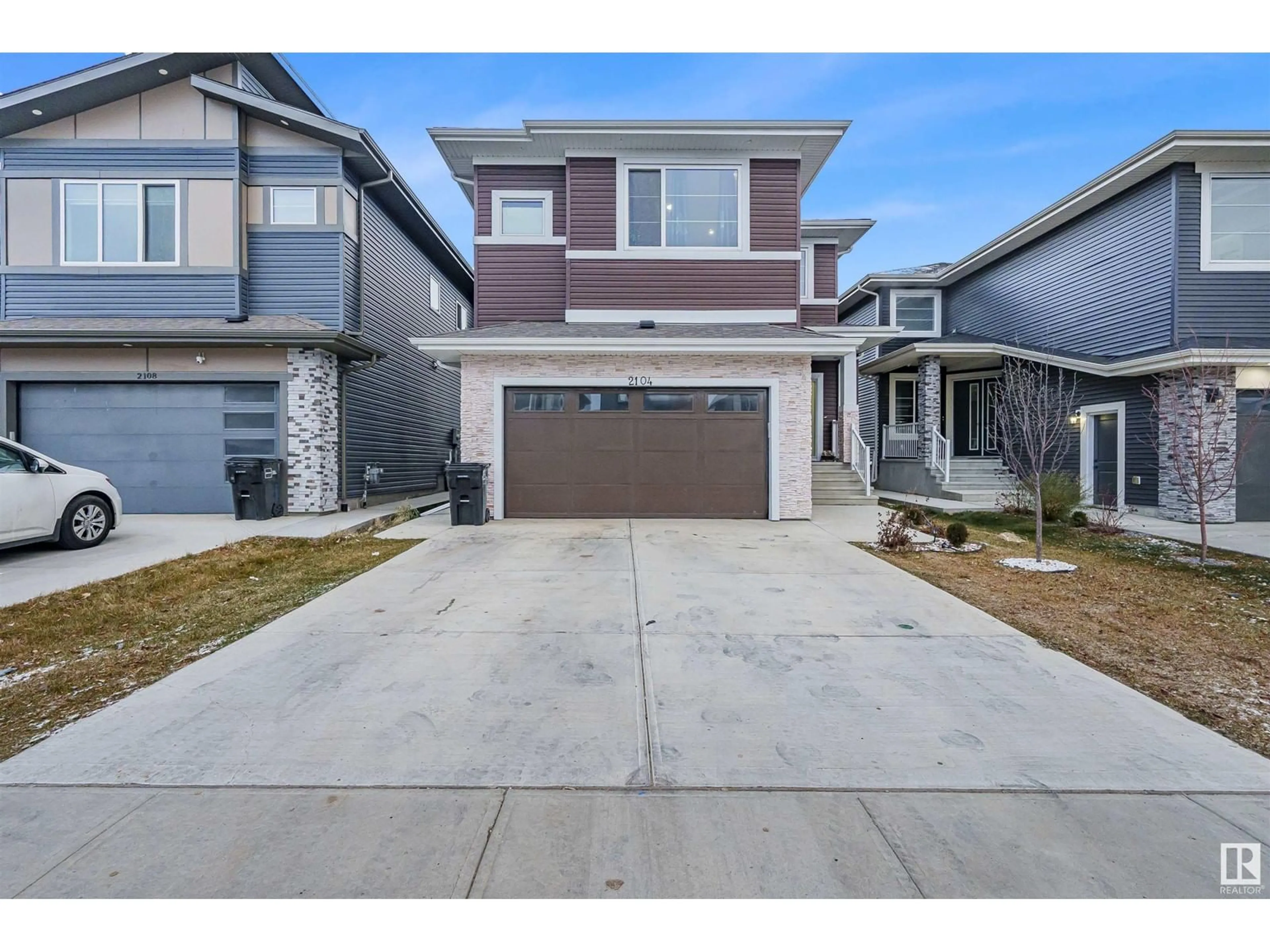 Frontside or backside of a home, the street view for 2104 18 AV NW, Edmonton Alberta T6T2M8