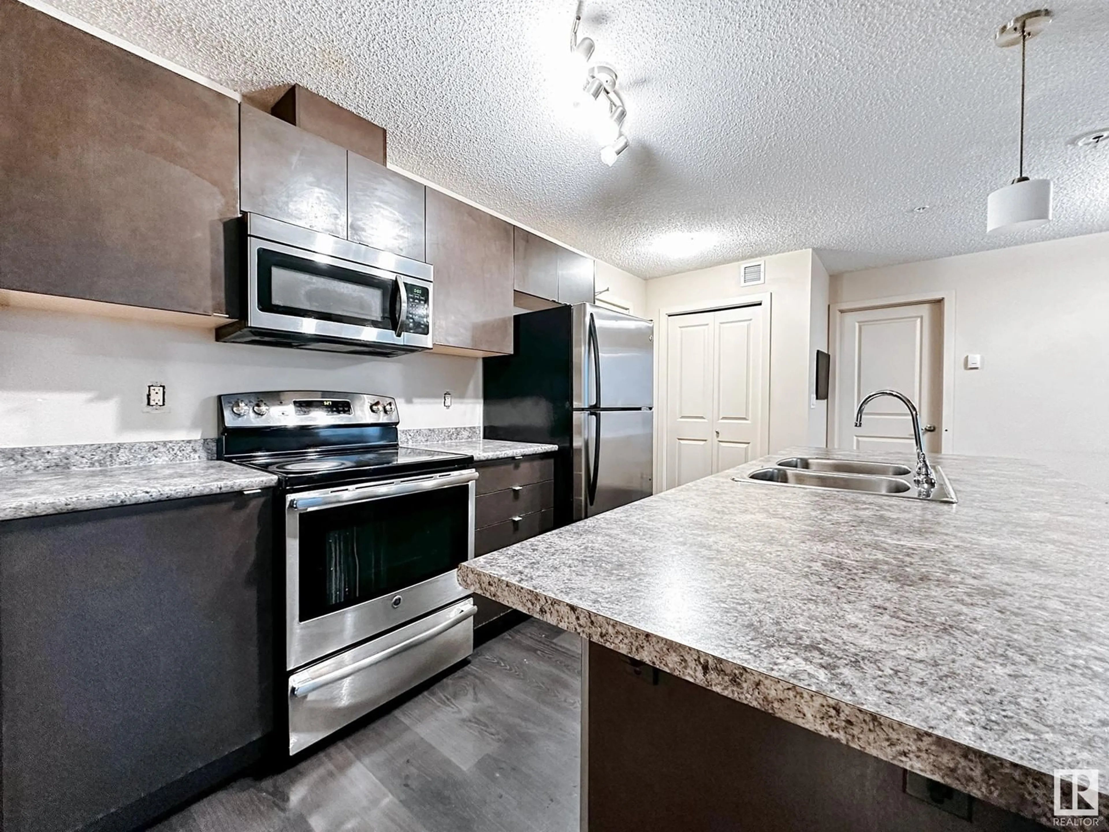 Standard kitchen, cement floor for #317 3357 16A AV NW, Edmonton Alberta T6T0V4