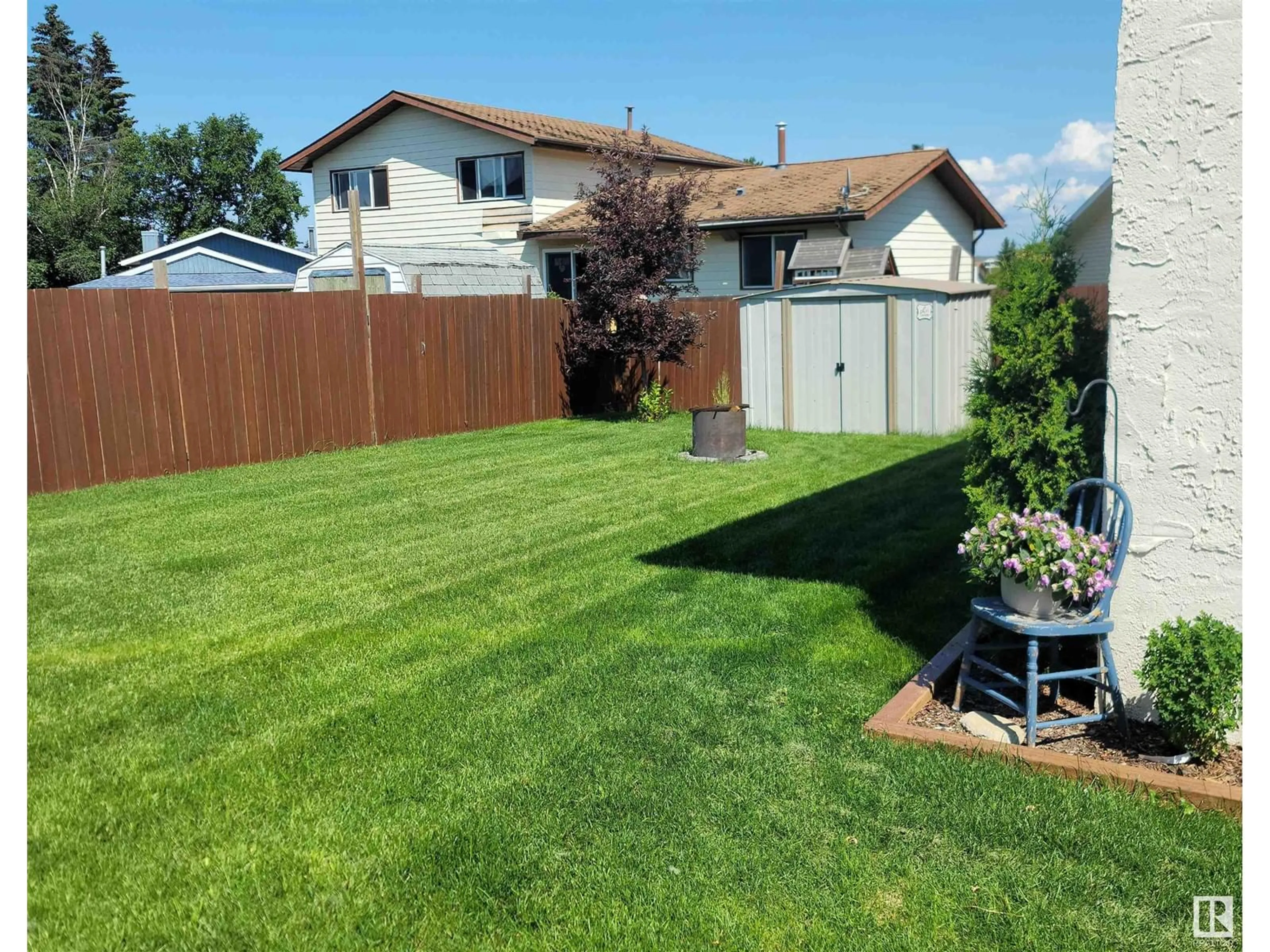 Frontside or backside of a home, the fenced backyard for 210 20A ST, Cold Lake Alberta T9M1G3