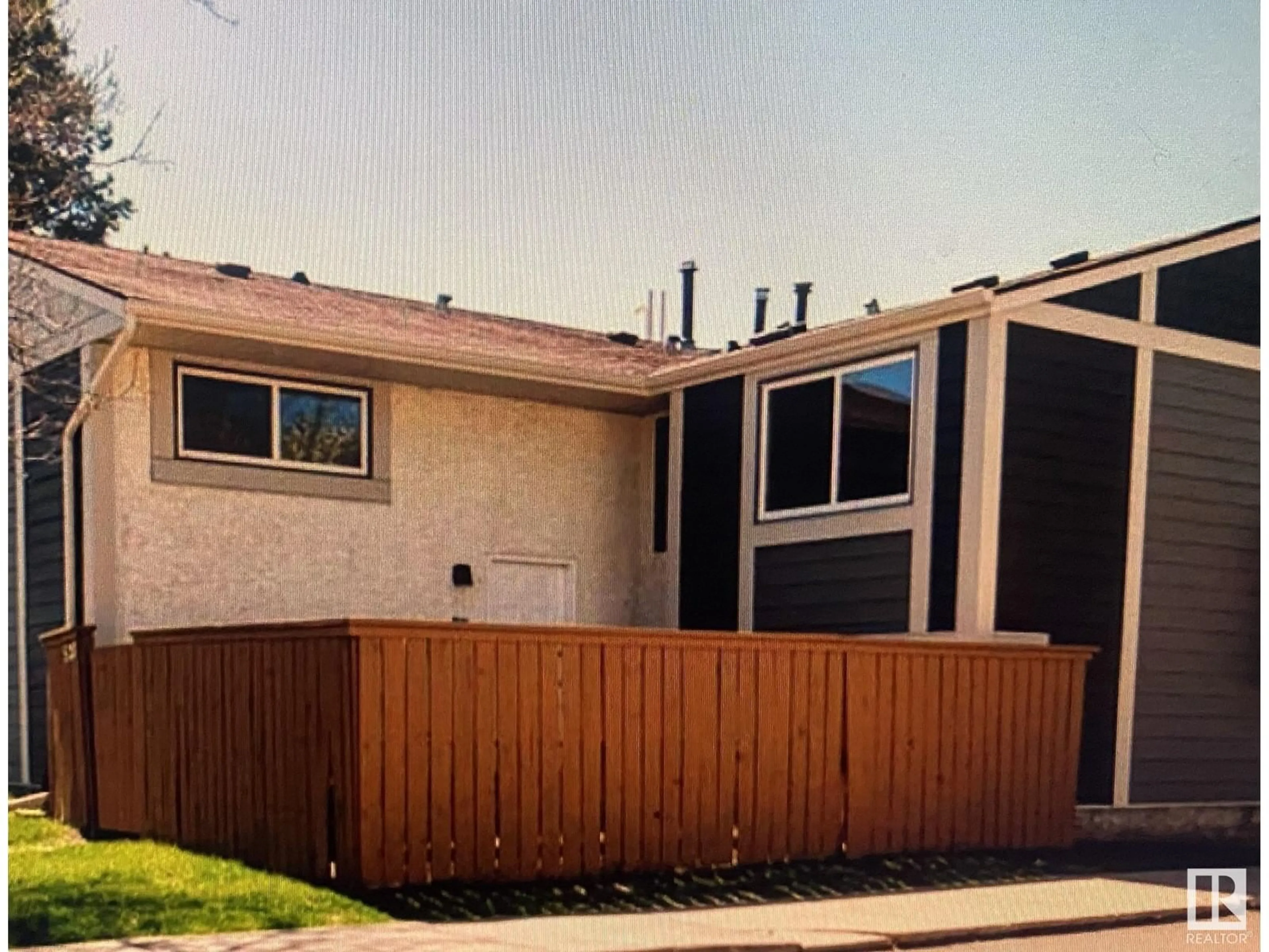 Frontside or backside of a home, the fenced backyard for 407 WILLOW CO NW, Edmonton Alberta T5T2K7