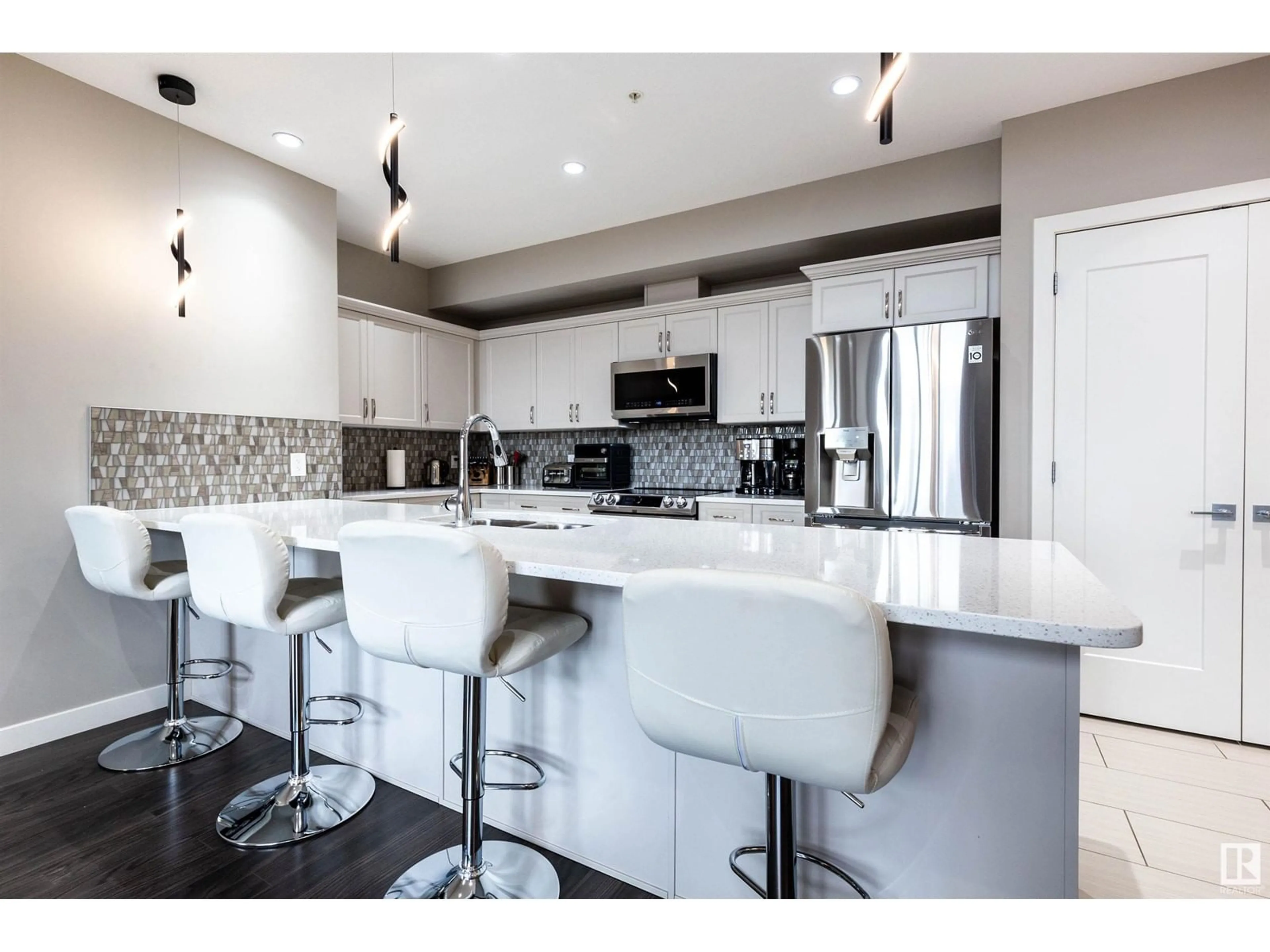 Open concept kitchen for #408 5029 EDGEMONT BV NW, Edmonton Alberta T6M0S8