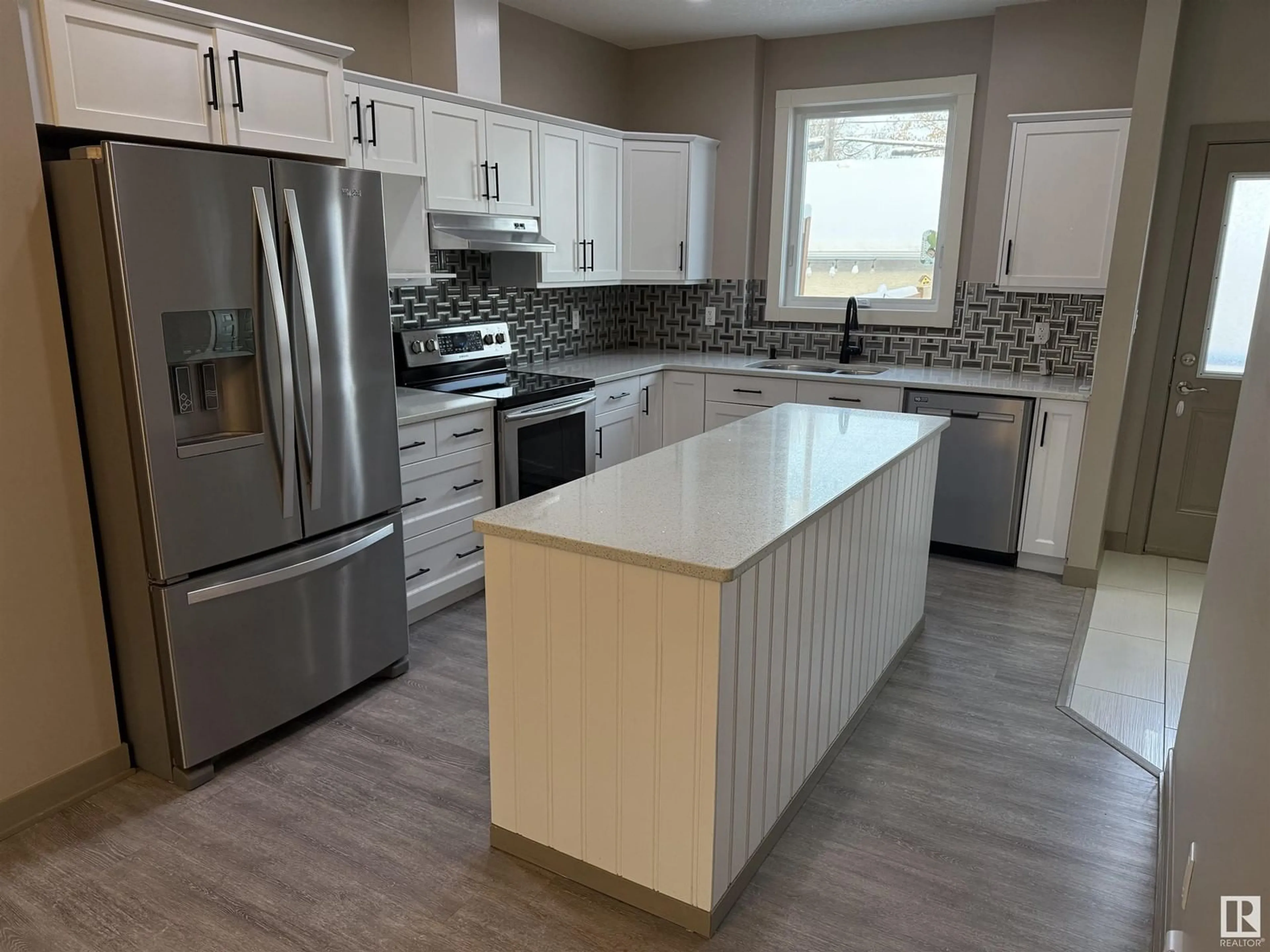 Open concept kitchen for 9824 73 AV NW, Edmonton Alberta T6E1B6