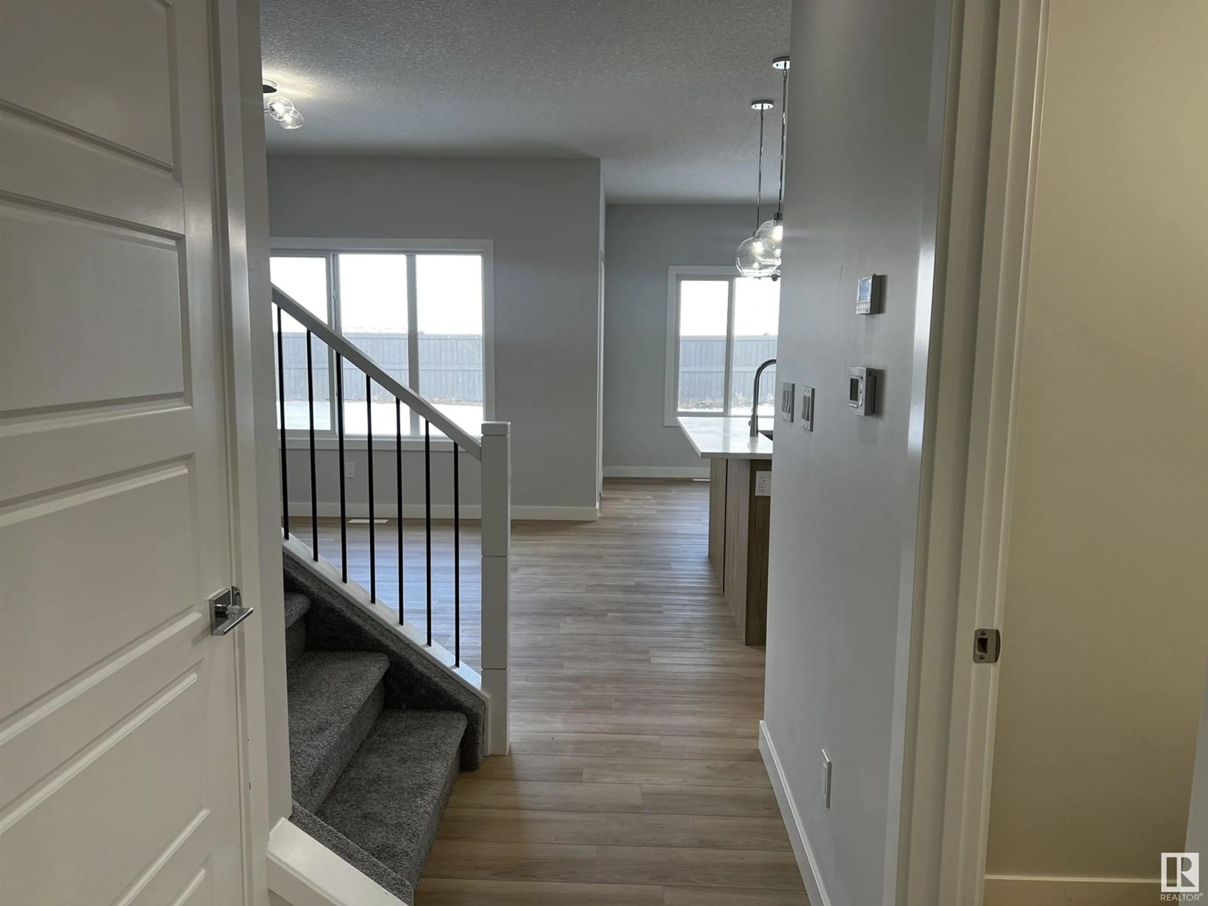 Indoor entryway, wood floors for 3225 Magpie Link NW, Edmonton Alberta T5S0V4