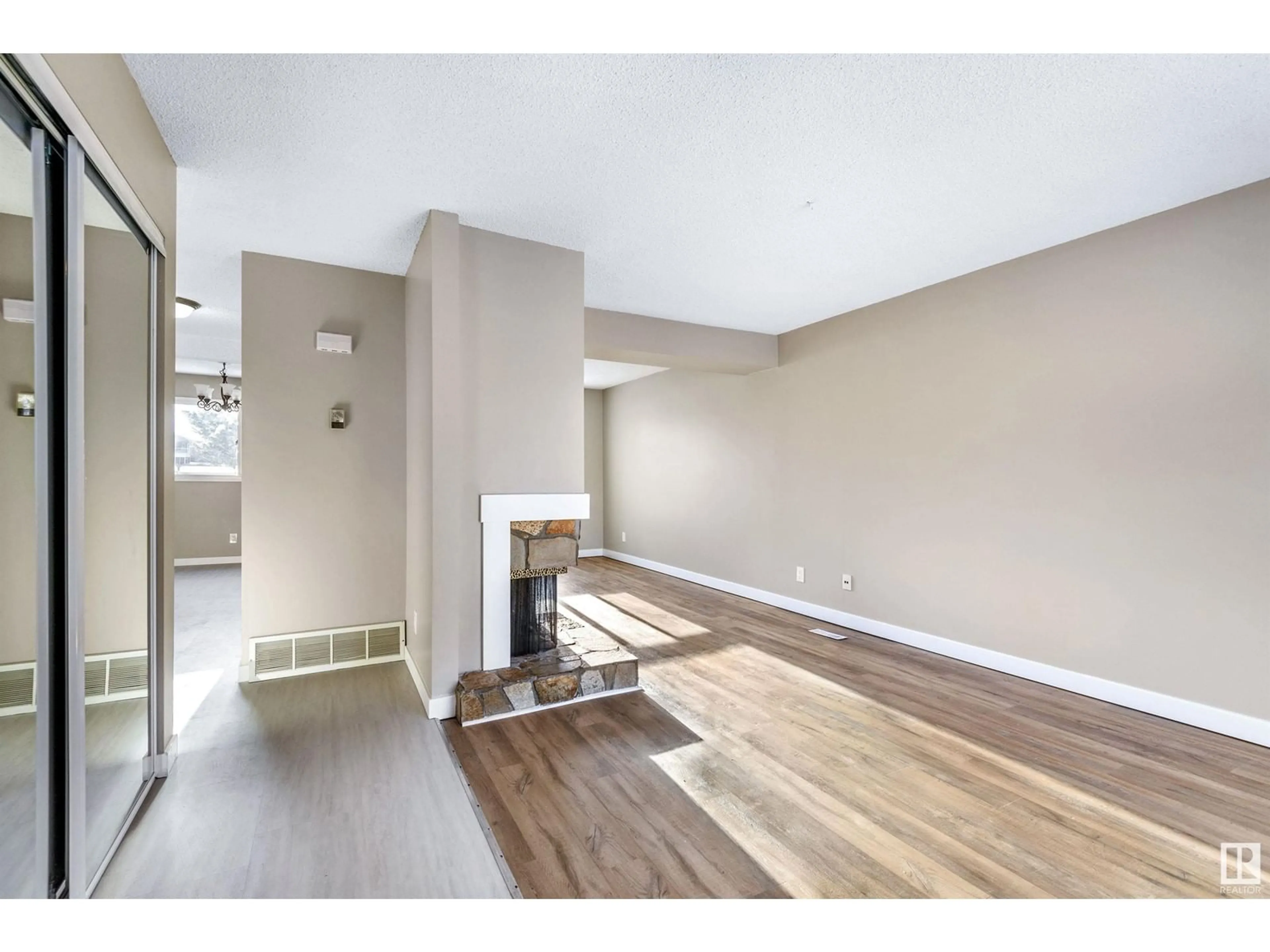 A pic of a room, wood floors for #5 1651 46 ST NW, Edmonton Alberta T6L5A2