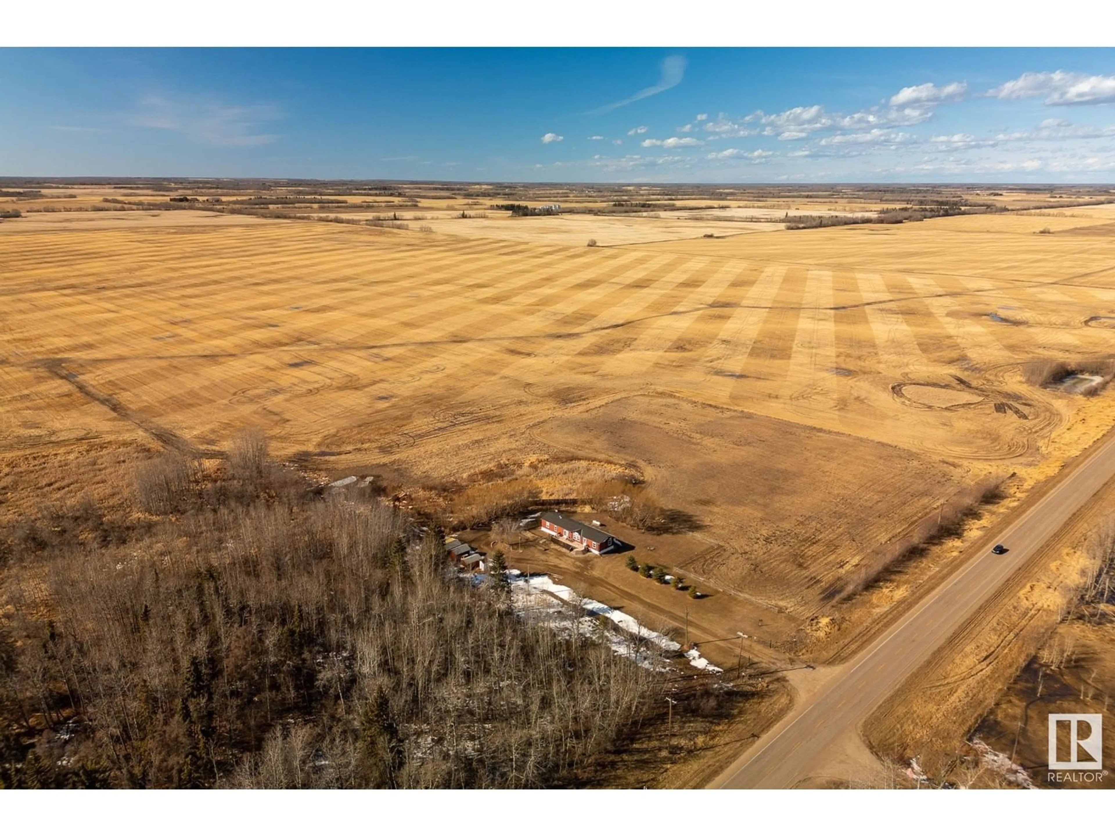 A pic from exterior of the house or condo, the fenced backyard for 60102 Hwy 827, Rural Thorhild County Alberta T0A3J0