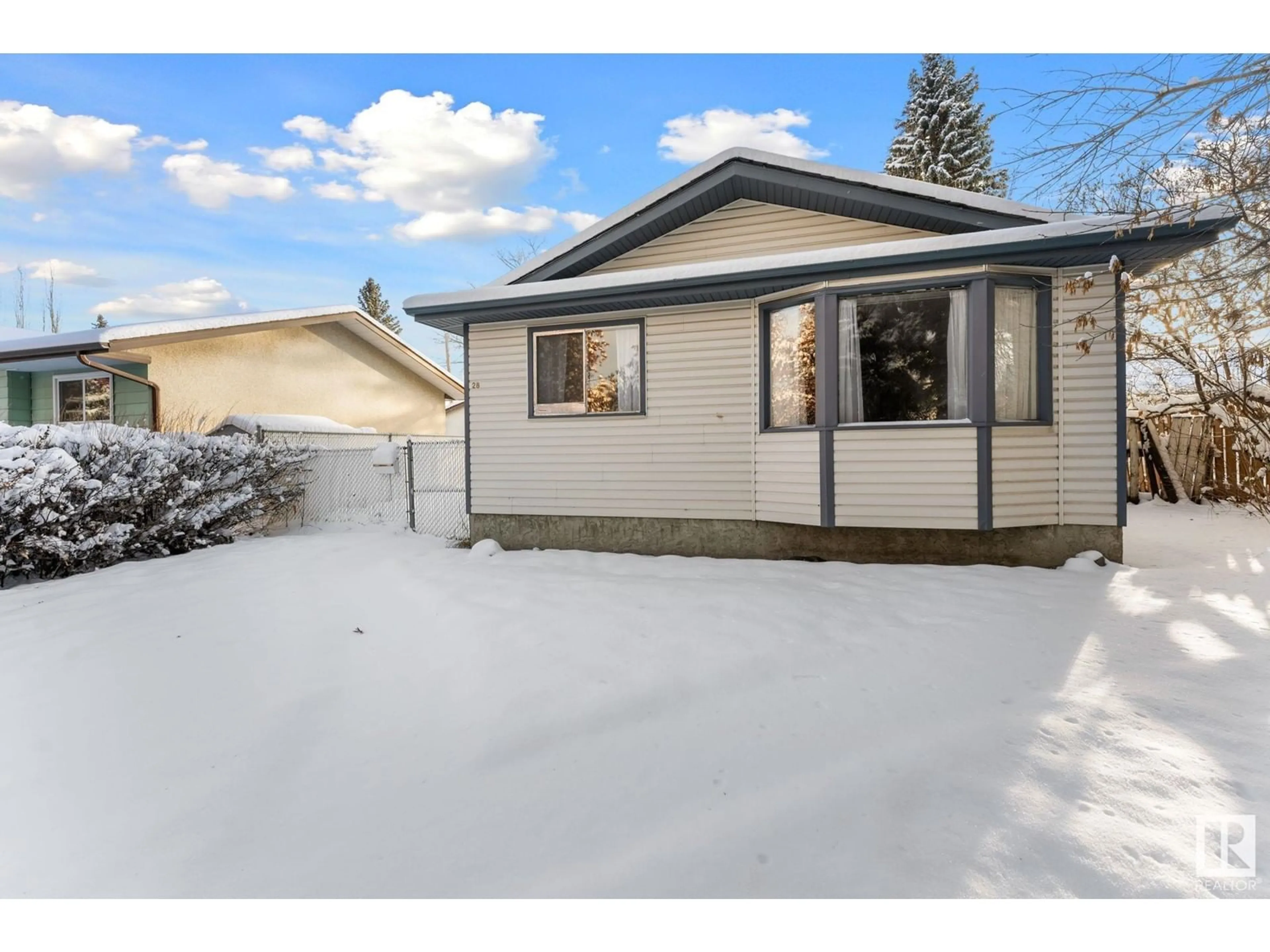 Frontside or backside of a home, the fenced backyard for 28 Manor DR, Spruce Grove Alberta T7X2G8