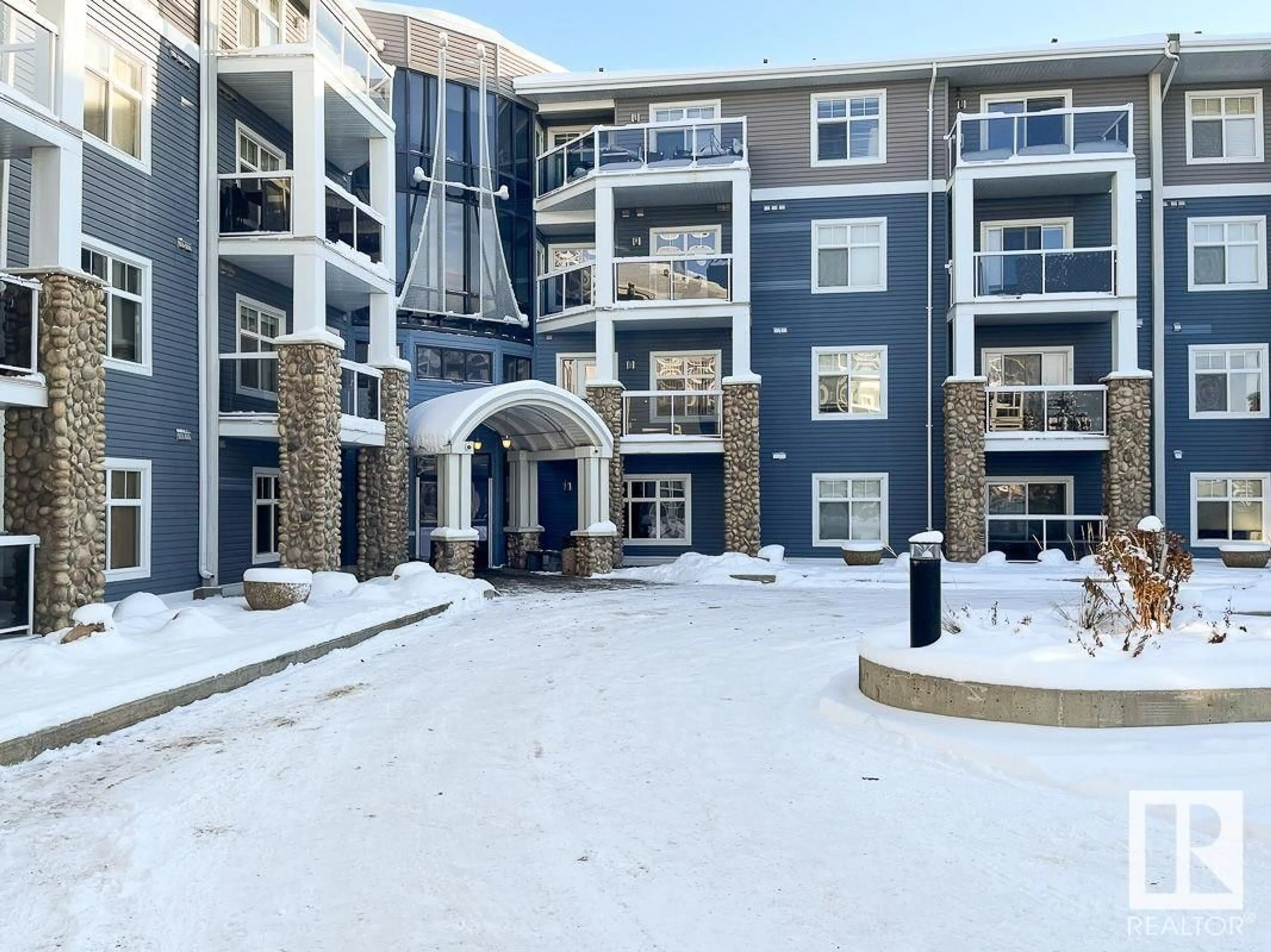 A pic from exterior of the house or condo, the front or back of building for #418 16035 132 ST NW, Edmonton Alberta T6V0B4