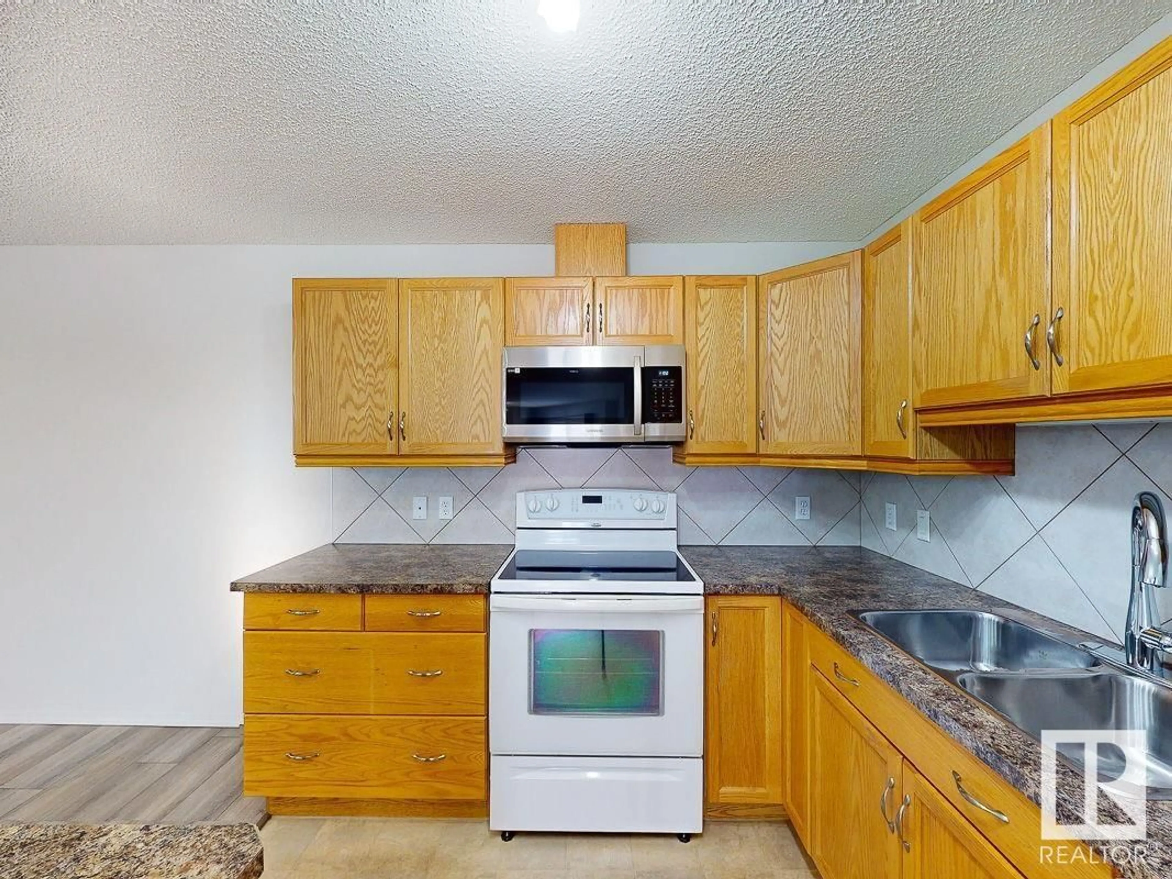 Standard kitchen, wood floors, cottage for #418 16035 132 ST NW, Edmonton Alberta T6V0B4