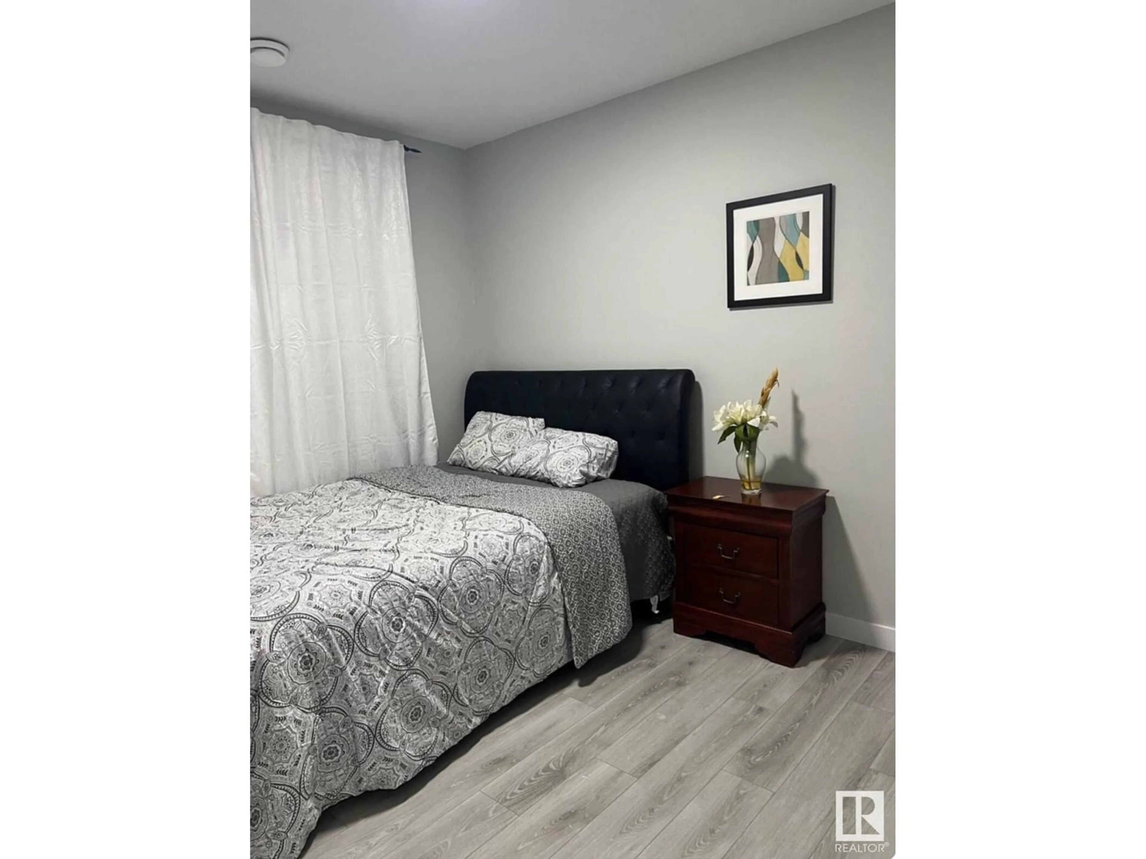 Bedroom with bed, wood/laminate floor for 17124 68 ST NW, Edmonton Alberta T5Z0W3