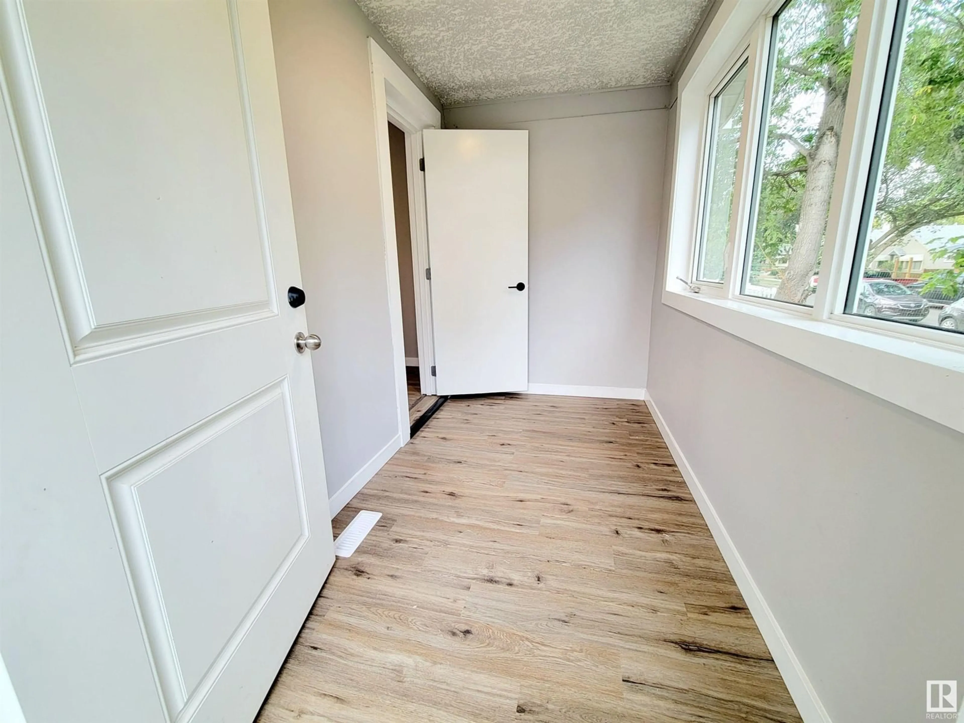 A pic of a room, wood floors for 12018 77 ST NW NW, Edmonton Alberta T5B2G7