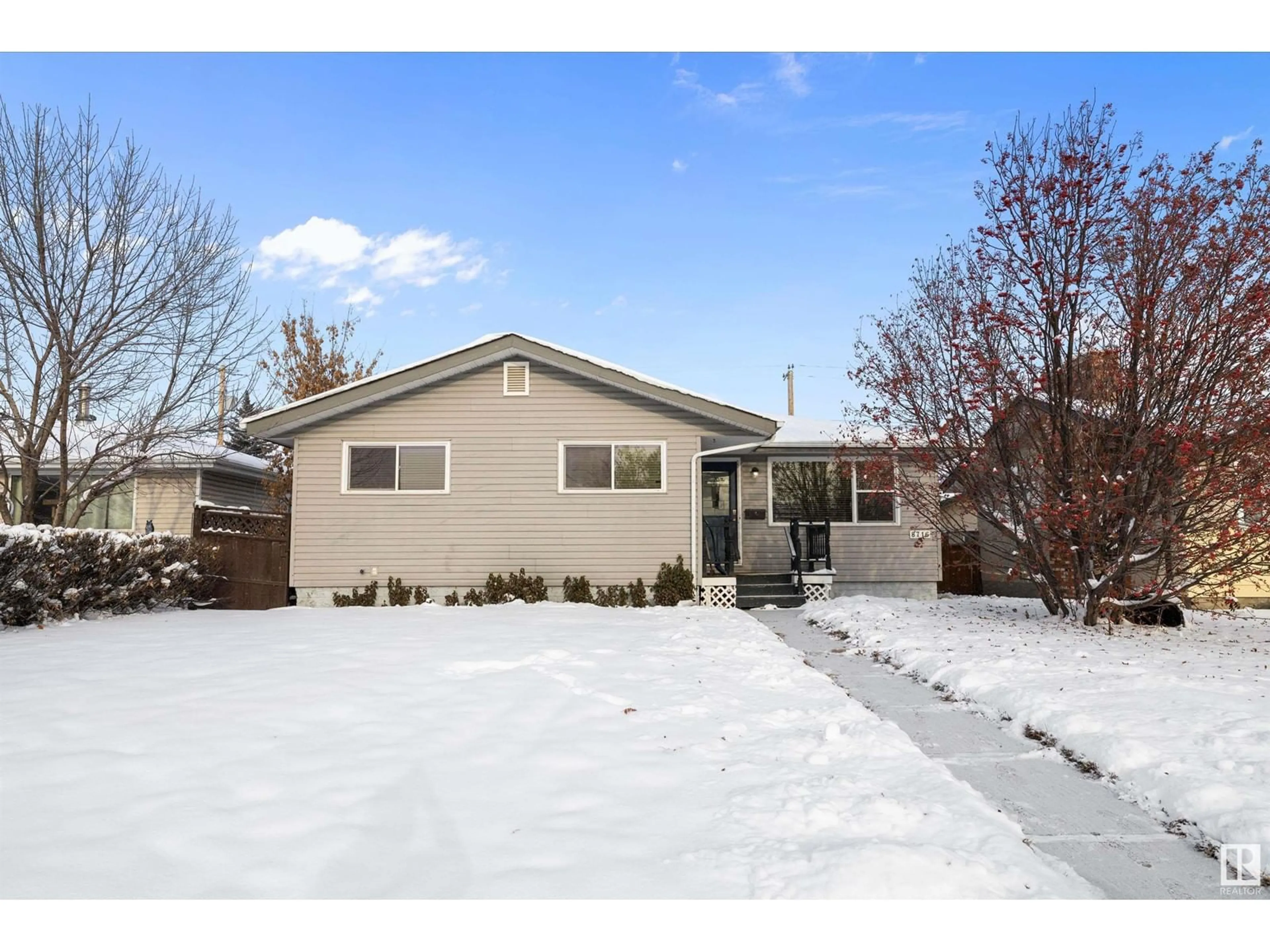 Frontside or backside of a home, the fenced backyard for 8716 136 AV NW, Edmonton Alberta T5E1V4