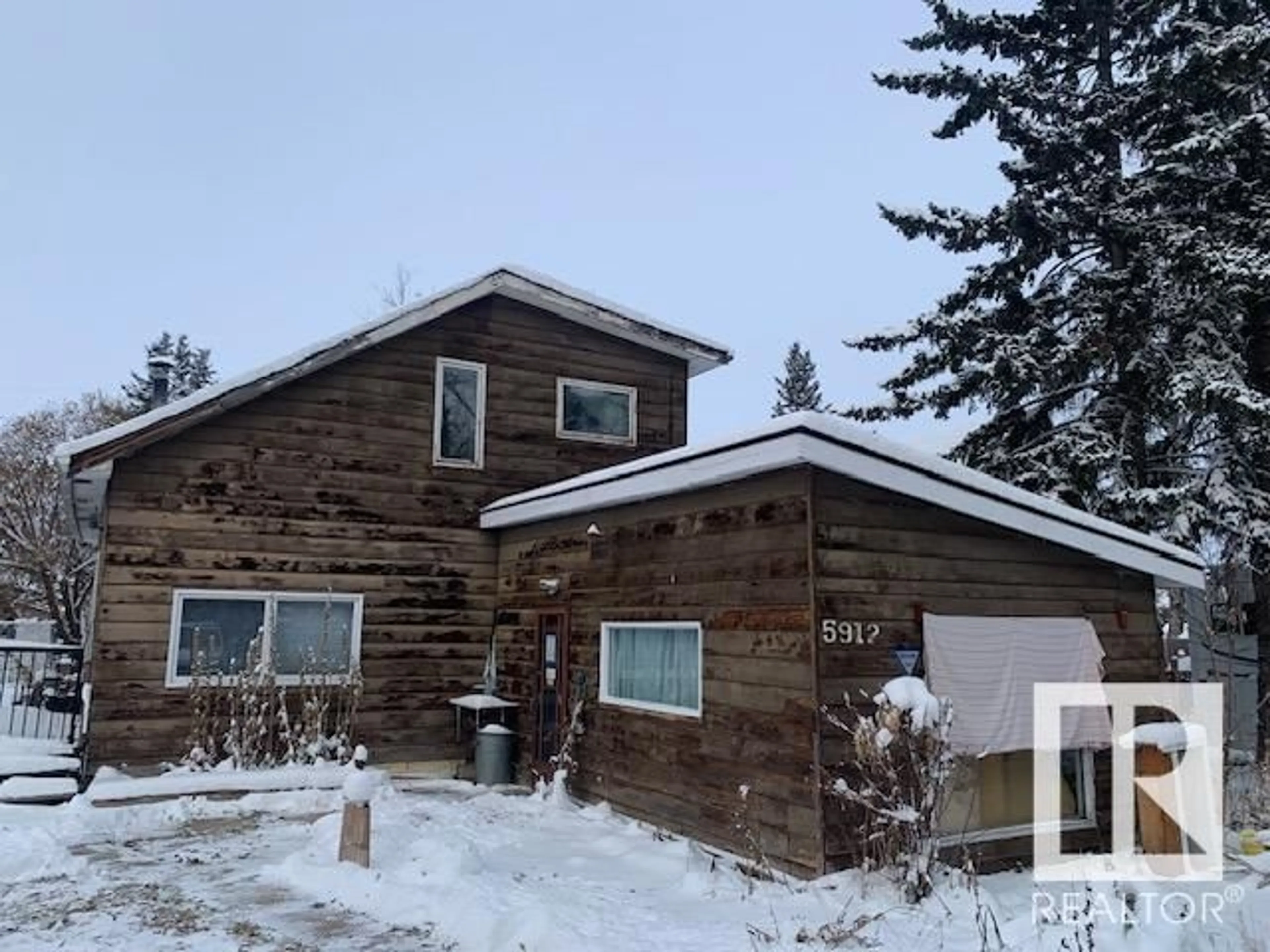 Frontside or backside of a home, the front or back of building for 5912 49 AV, Rural Lac Ste. Anne County Alberta T0E0A0