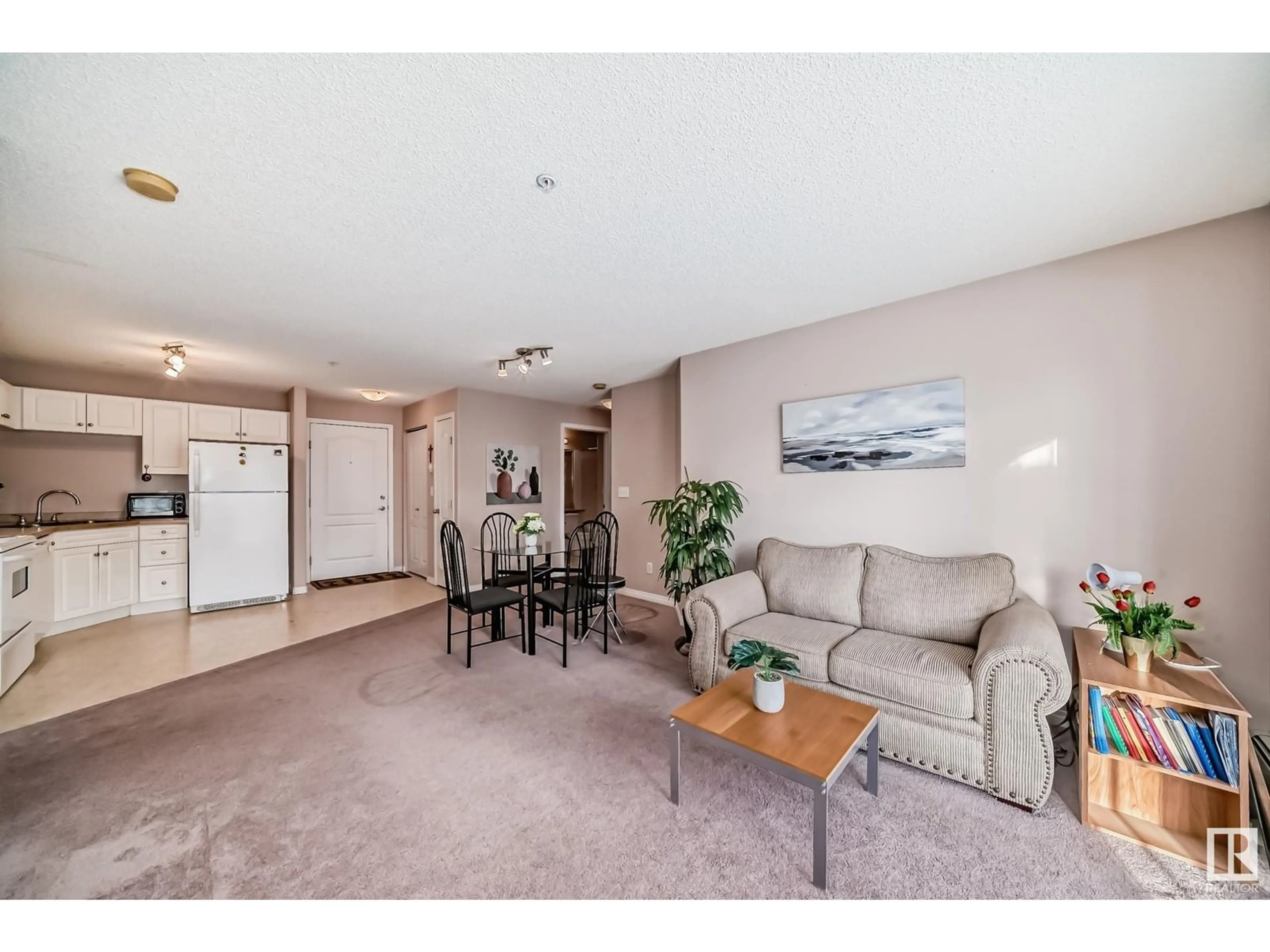 Living room, carpet floors for #227 9525 162 AV NW, Edmonton Alberta T5Z3V2