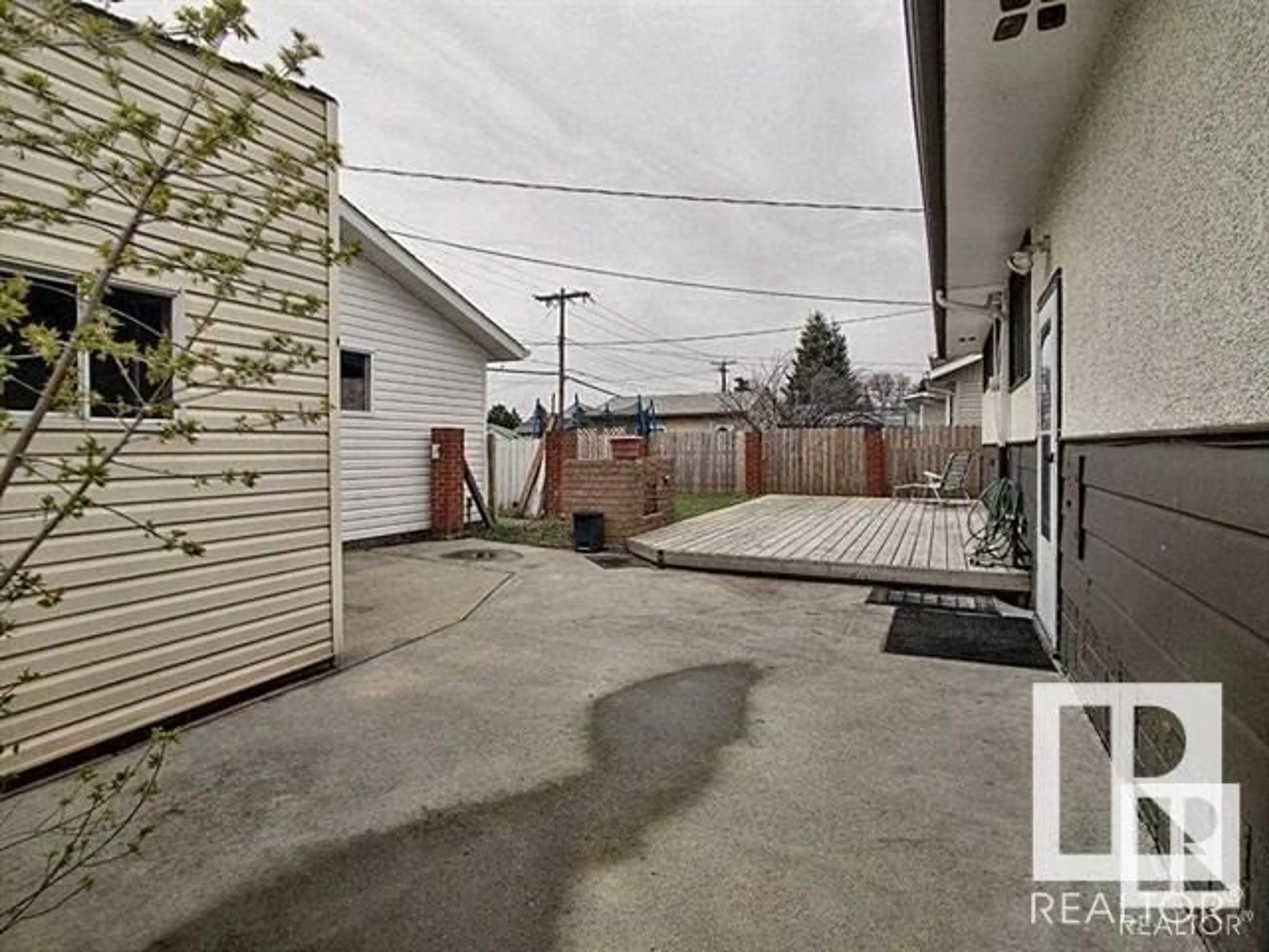 Frontside or backside of a home, the fenced backyard for 16322 87 AV NW, Edmonton Alberta T5R4H2