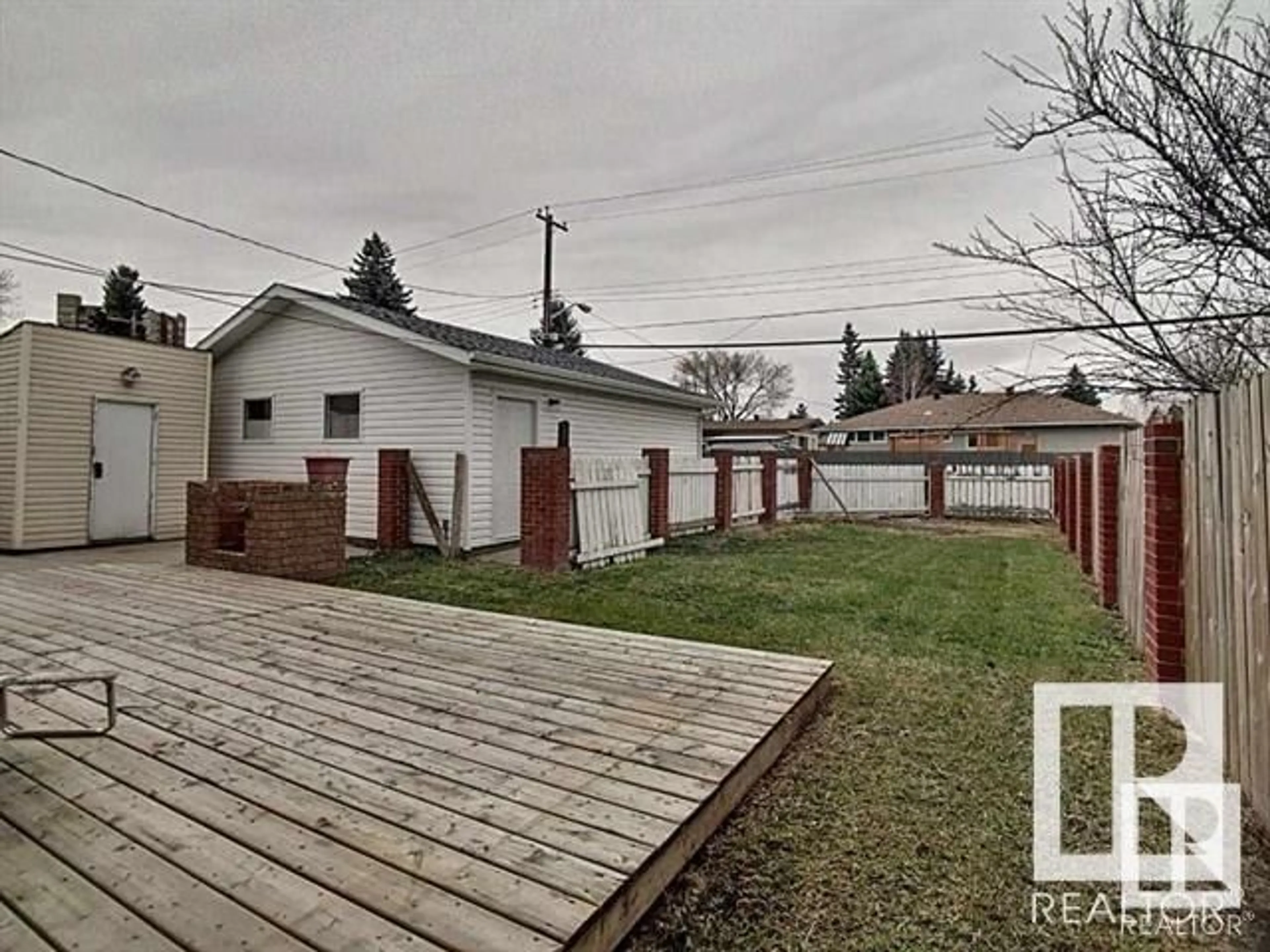 Patio, the fenced backyard for 16322 87 AV NW, Edmonton Alberta T5R4H2