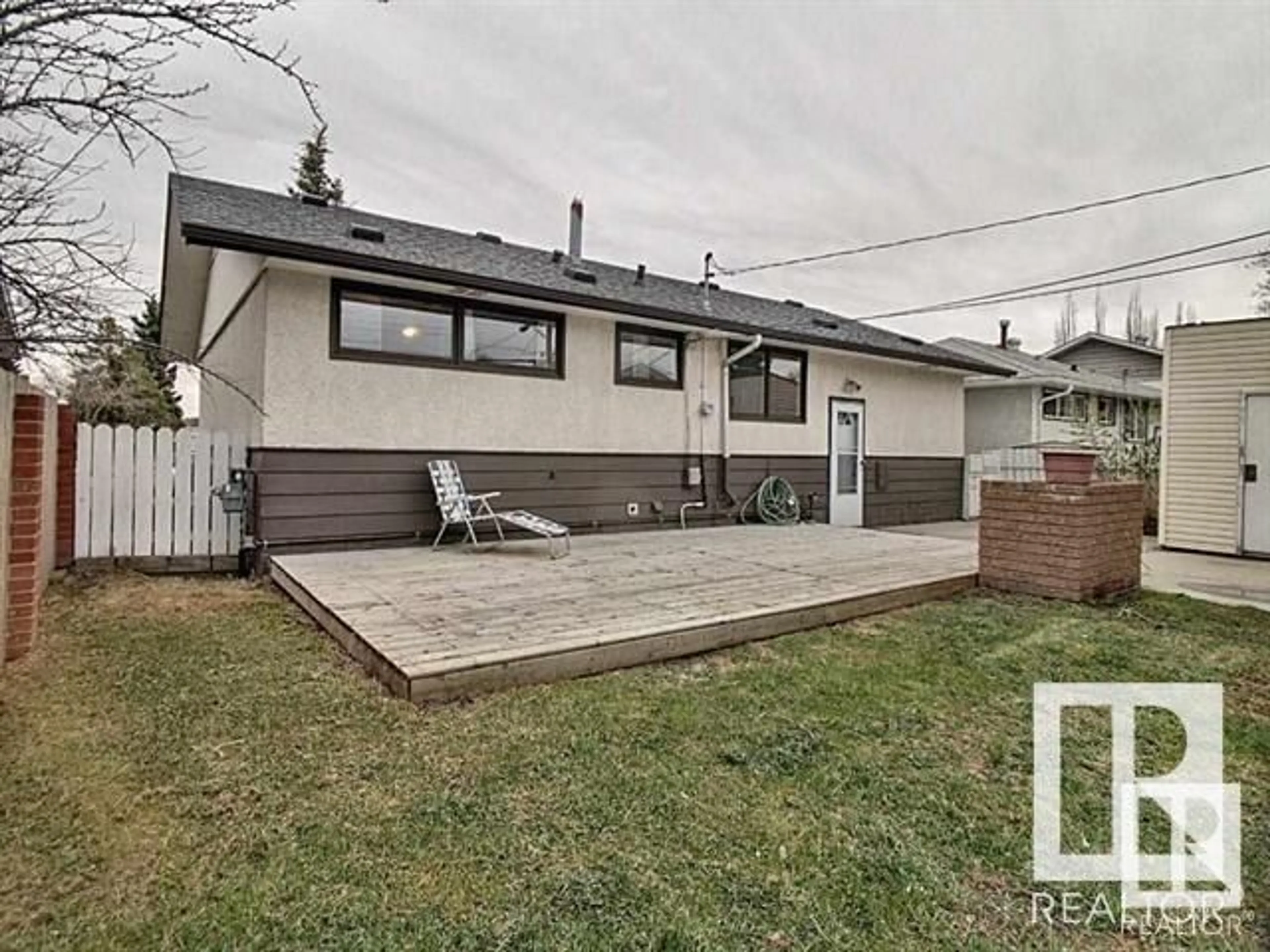 Frontside or backside of a home, the fenced backyard for 16322 87 AV NW, Edmonton Alberta T5R4H2