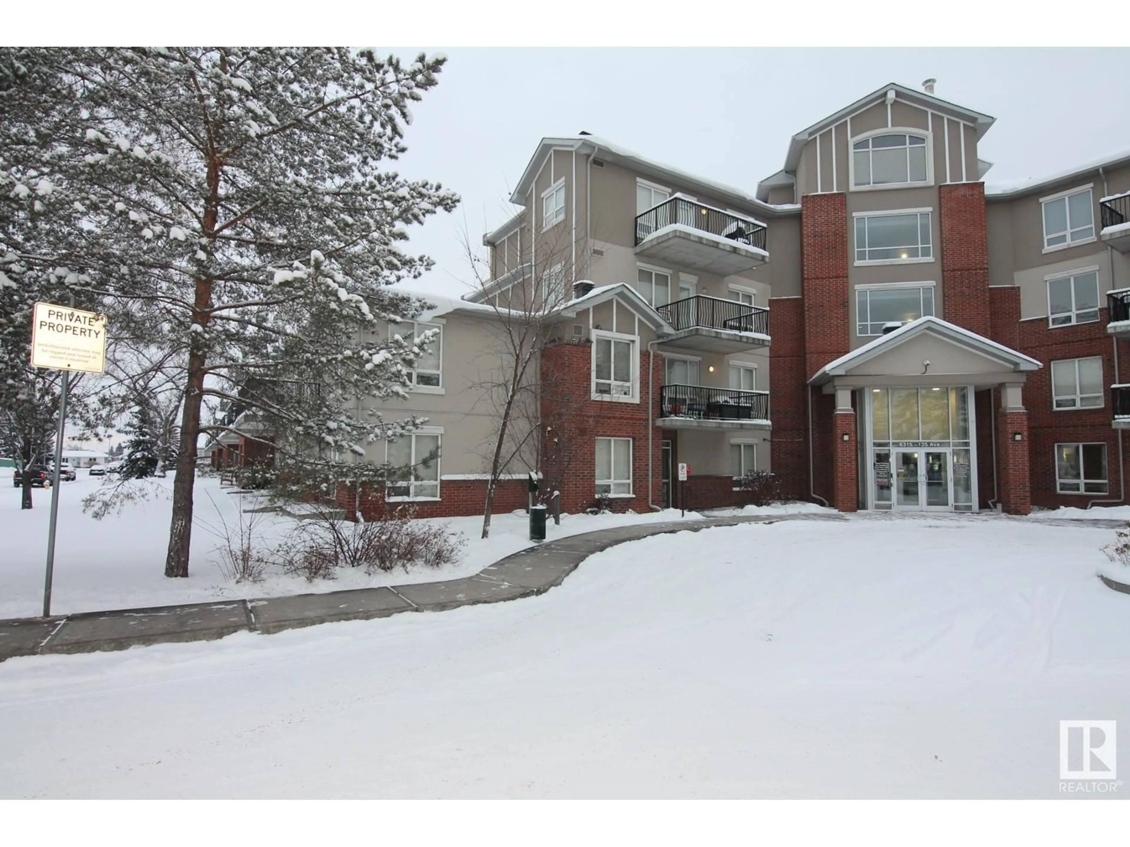 A pic from exterior of the house or condo, the front or back of building for #111 6315 135 AV NW, Edmonton Alberta T5A5J7