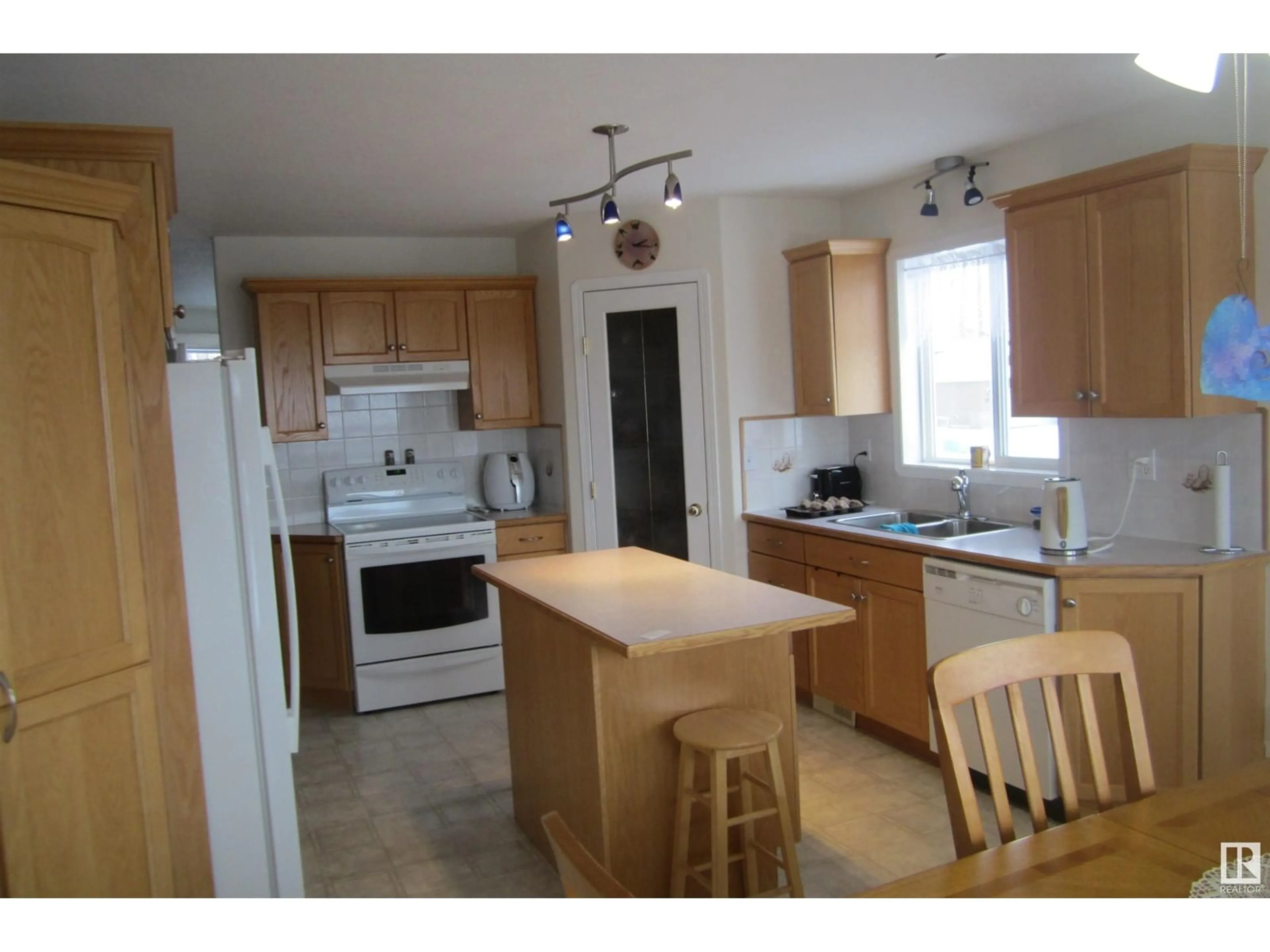 Standard kitchen, wood floors, cottage for 150 Pipestone DR, Millet Alberta T0C1Z0