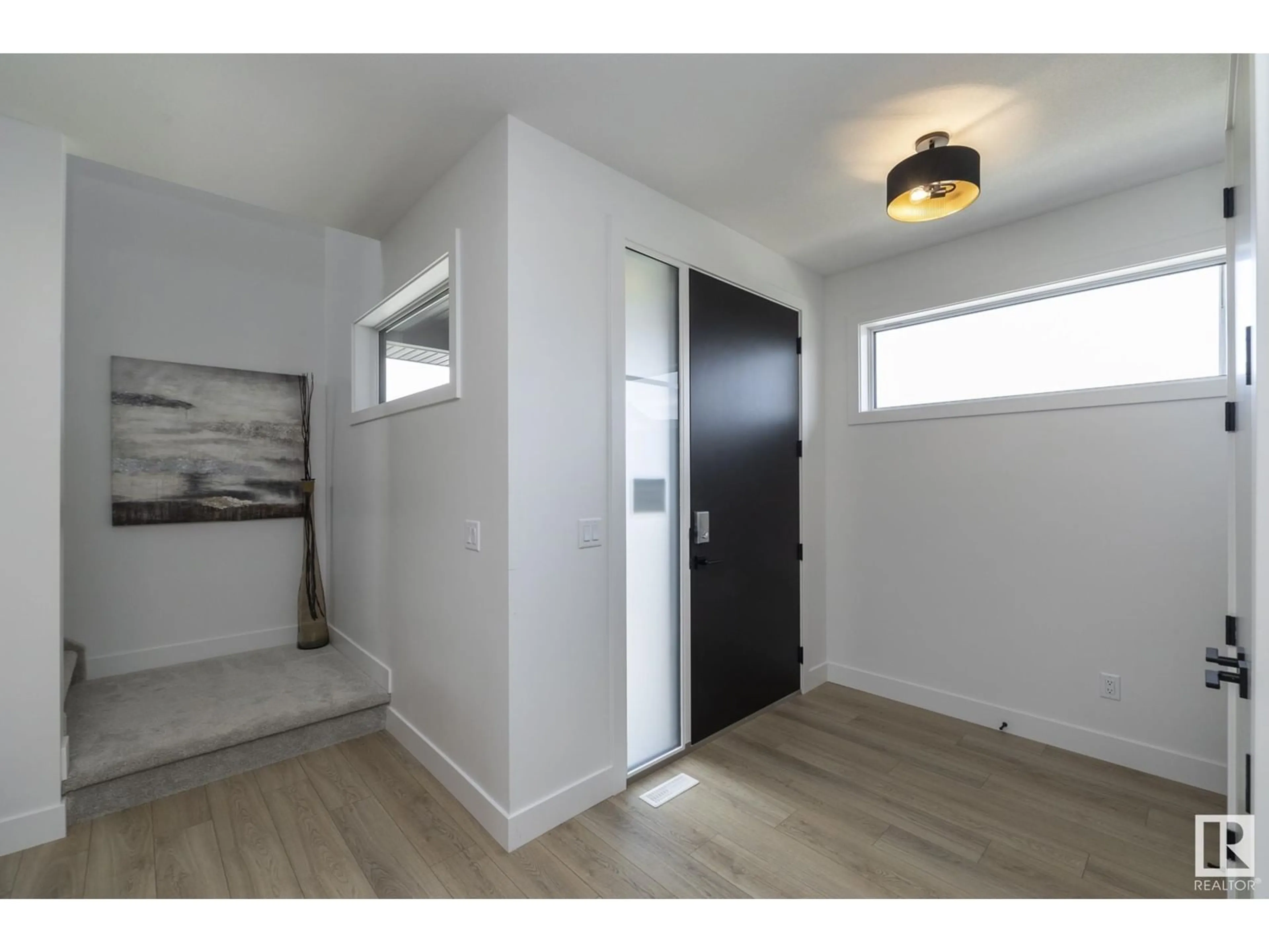 Indoor entryway, wood floors for 4541 Knight WD SW, Edmonton Alberta T6W4B7