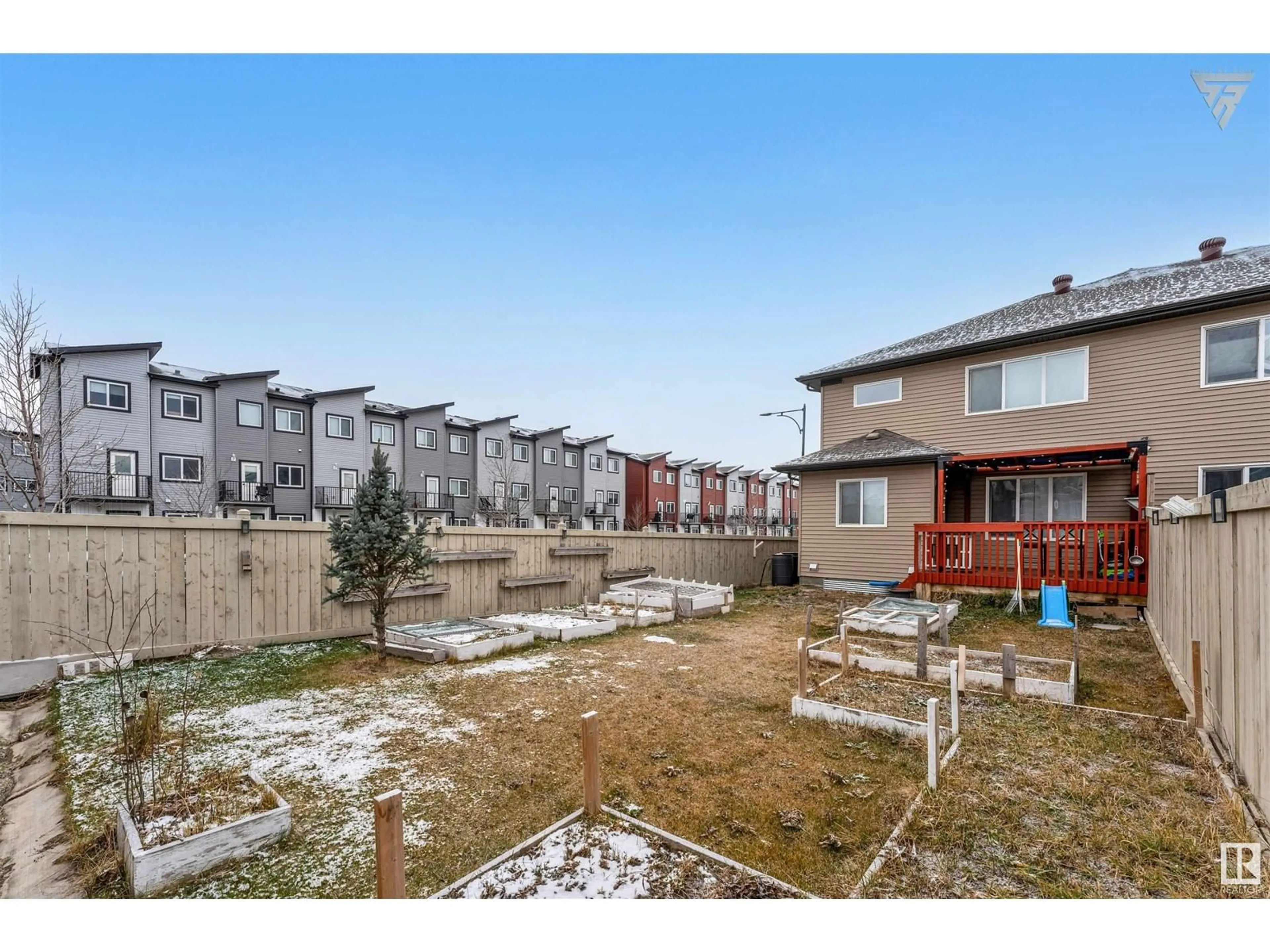 A pic from exterior of the house or condo, the fenced backyard for 4403 5 ST NW, Edmonton Alberta T6T0Z9