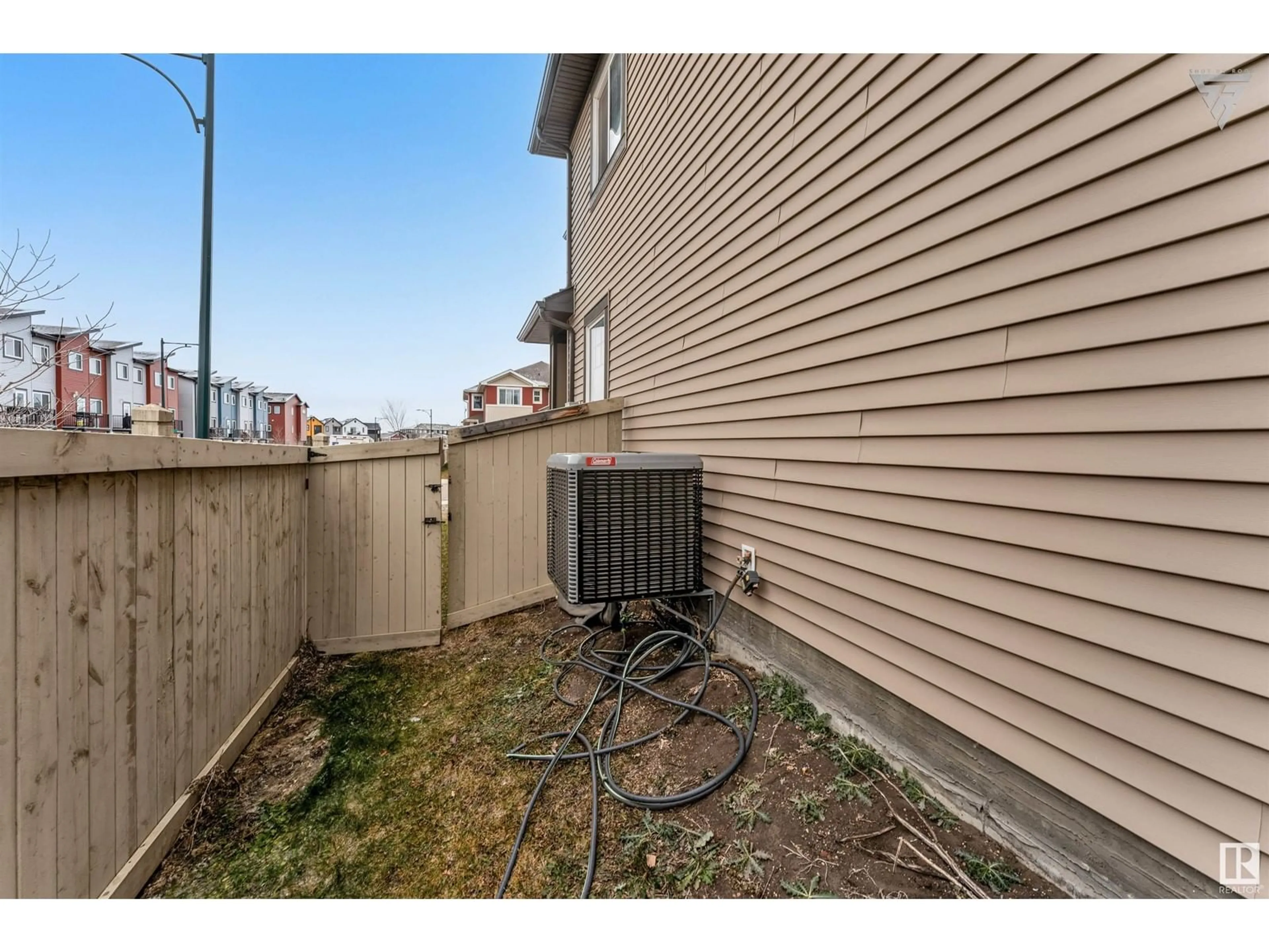 A pic from exterior of the house or condo, the fenced backyard for 4403 5 ST NW, Edmonton Alberta T6T0Z9