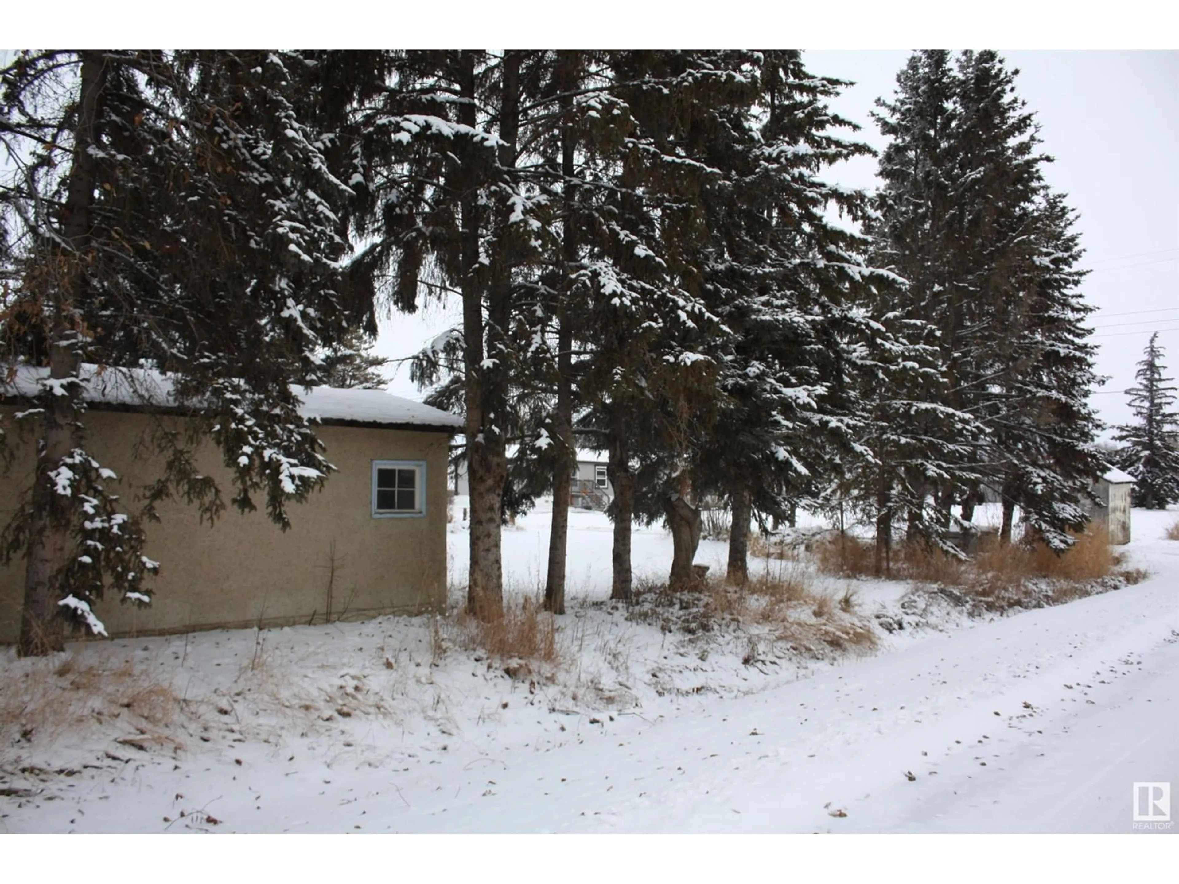 A pic from exterior of the house or condo, the fenced backyard for 5203 49 STREET, Waskatenau Alberta T0A3P0