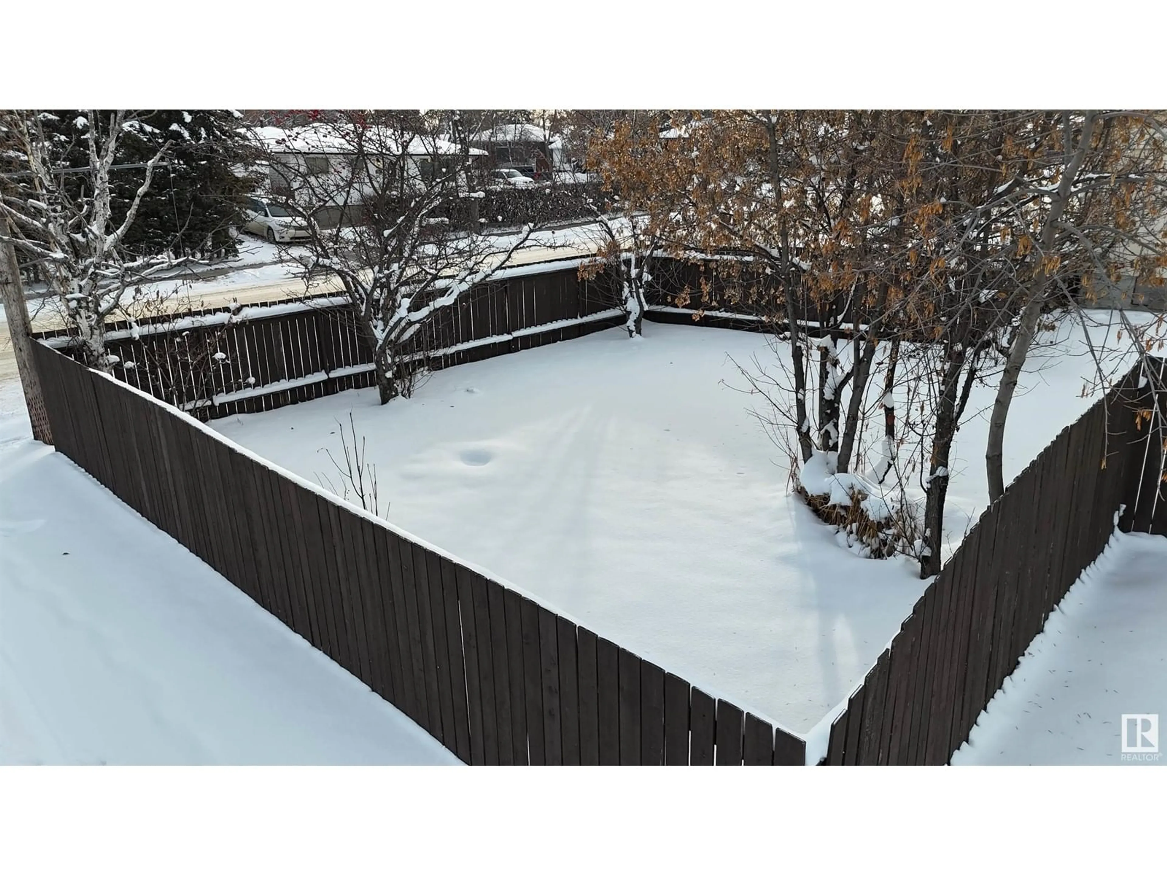 Frontside or backside of a home, the fenced backyard for 5404 48 ST, Drayton Valley Alberta T7A1C2