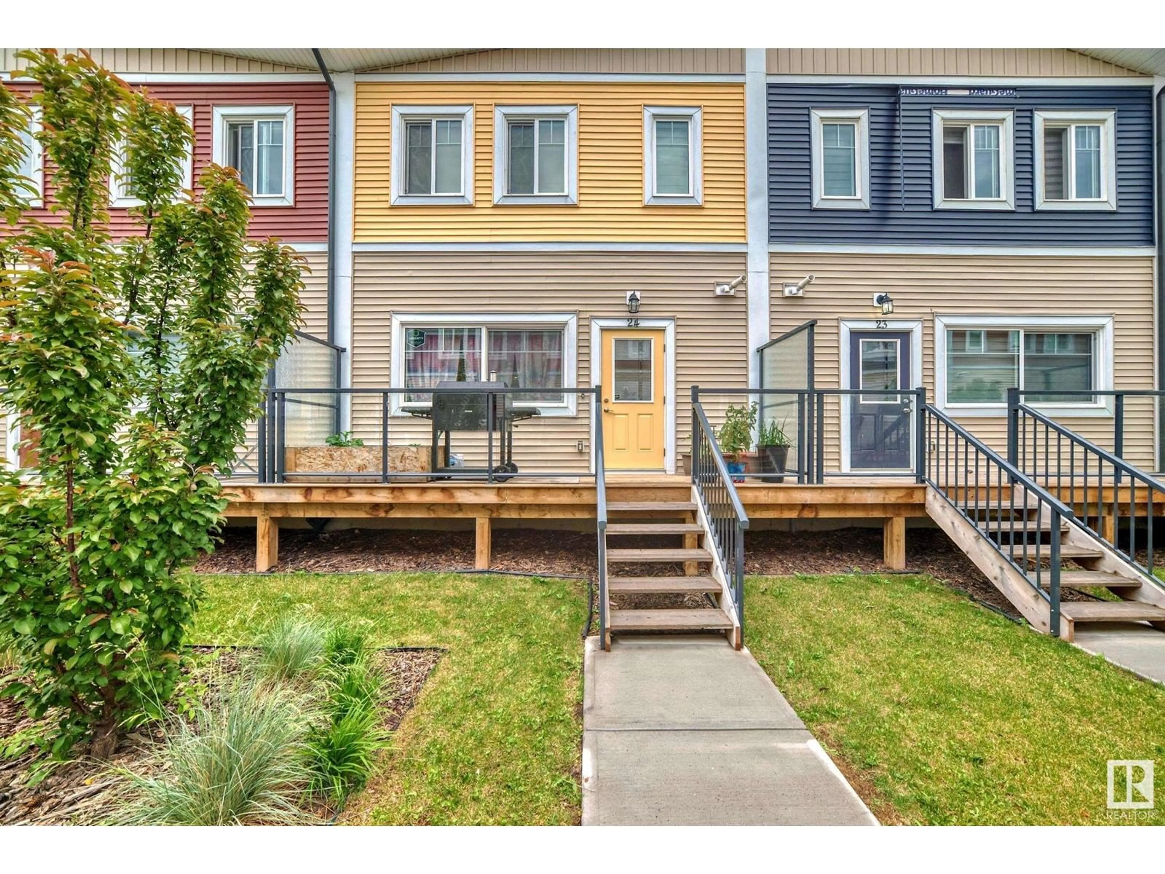 A pic from exterior of the house or condo, the fenced backyard for #24 2803 14 AV NW, Edmonton Alberta T6T2K4