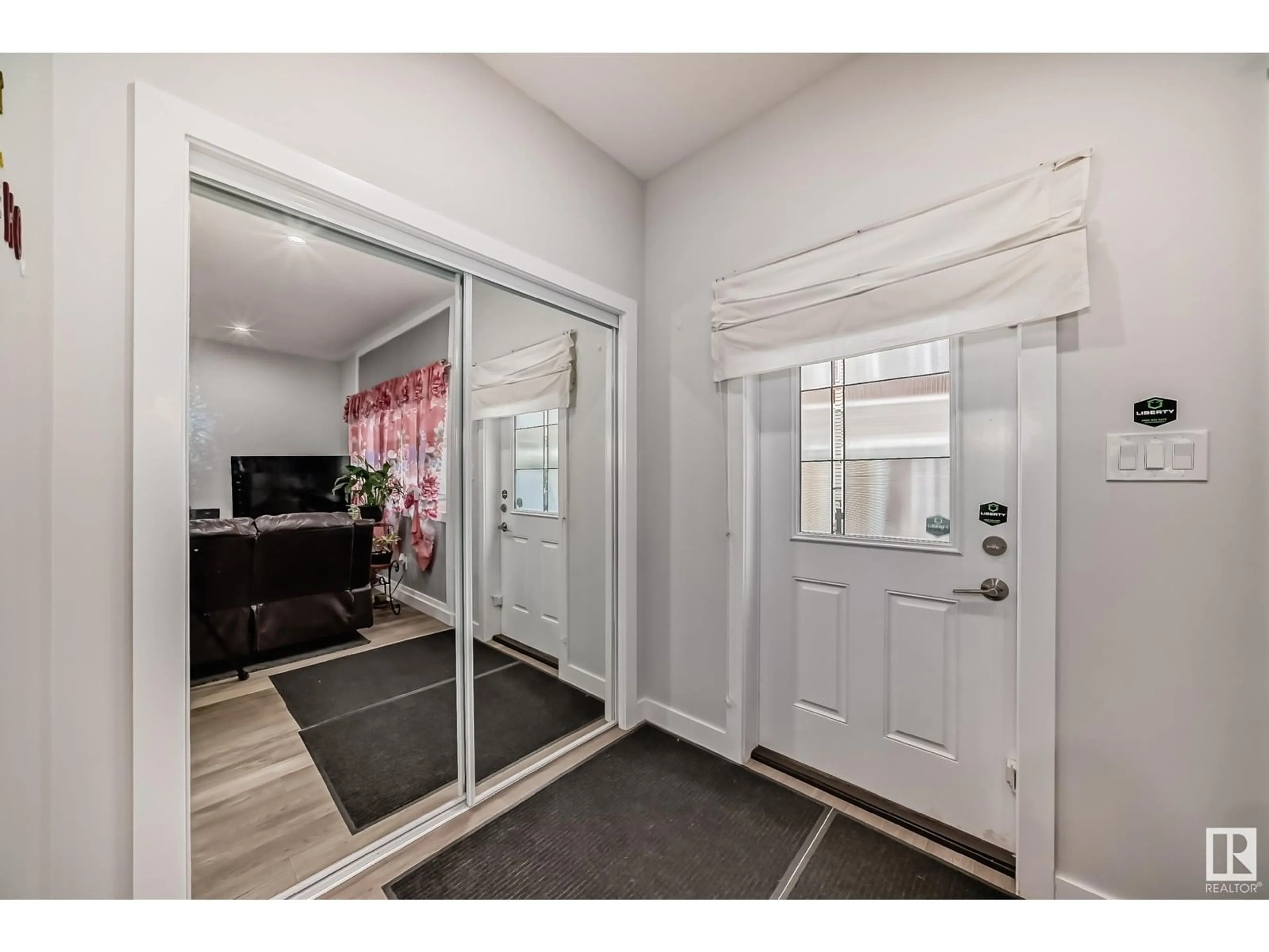 Indoor entryway, wood floors for #24 2803 14 AV NW, Edmonton Alberta T6T2K4