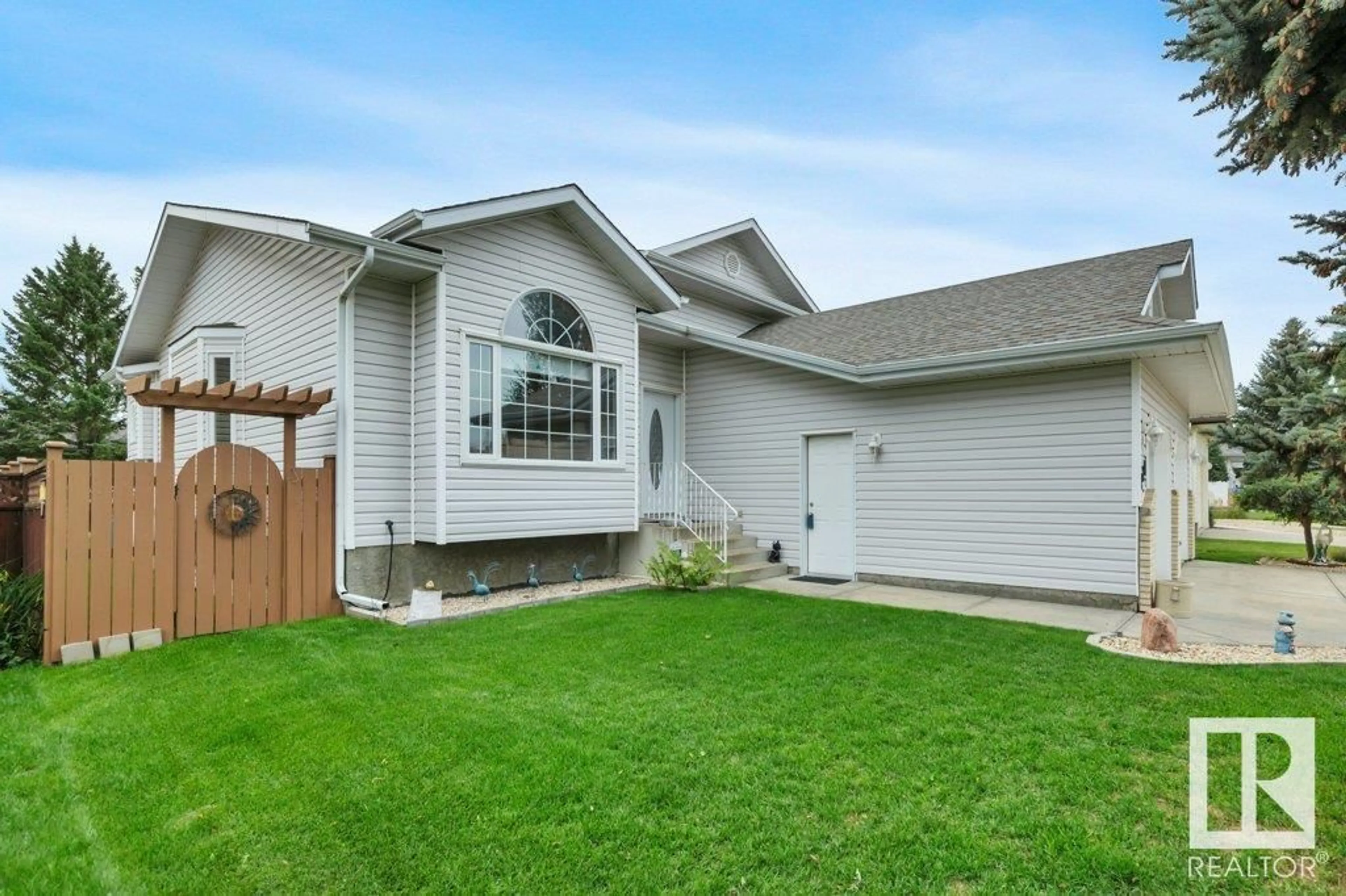 Frontside or backside of a home, the fenced backyard for 229 Northmount DR, Wetaskiwin Alberta T9A3M4